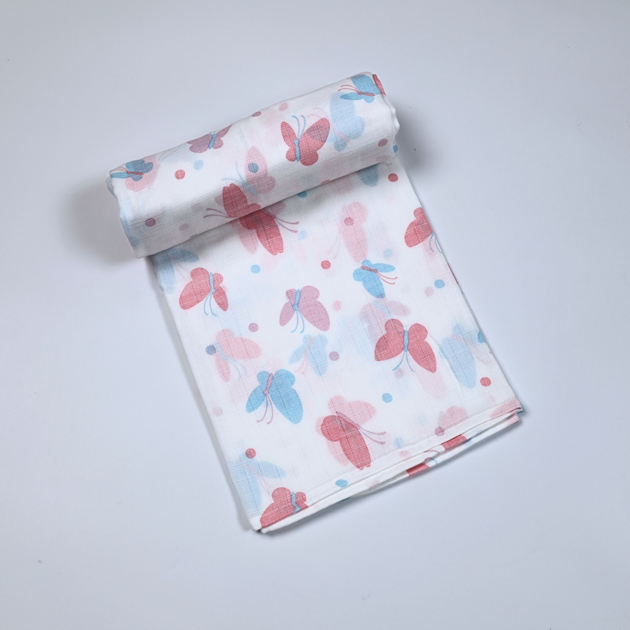 Butterfly Blush baby bath towel
 in white printed with pastel butterfly motifs in soft pink and blue tones.