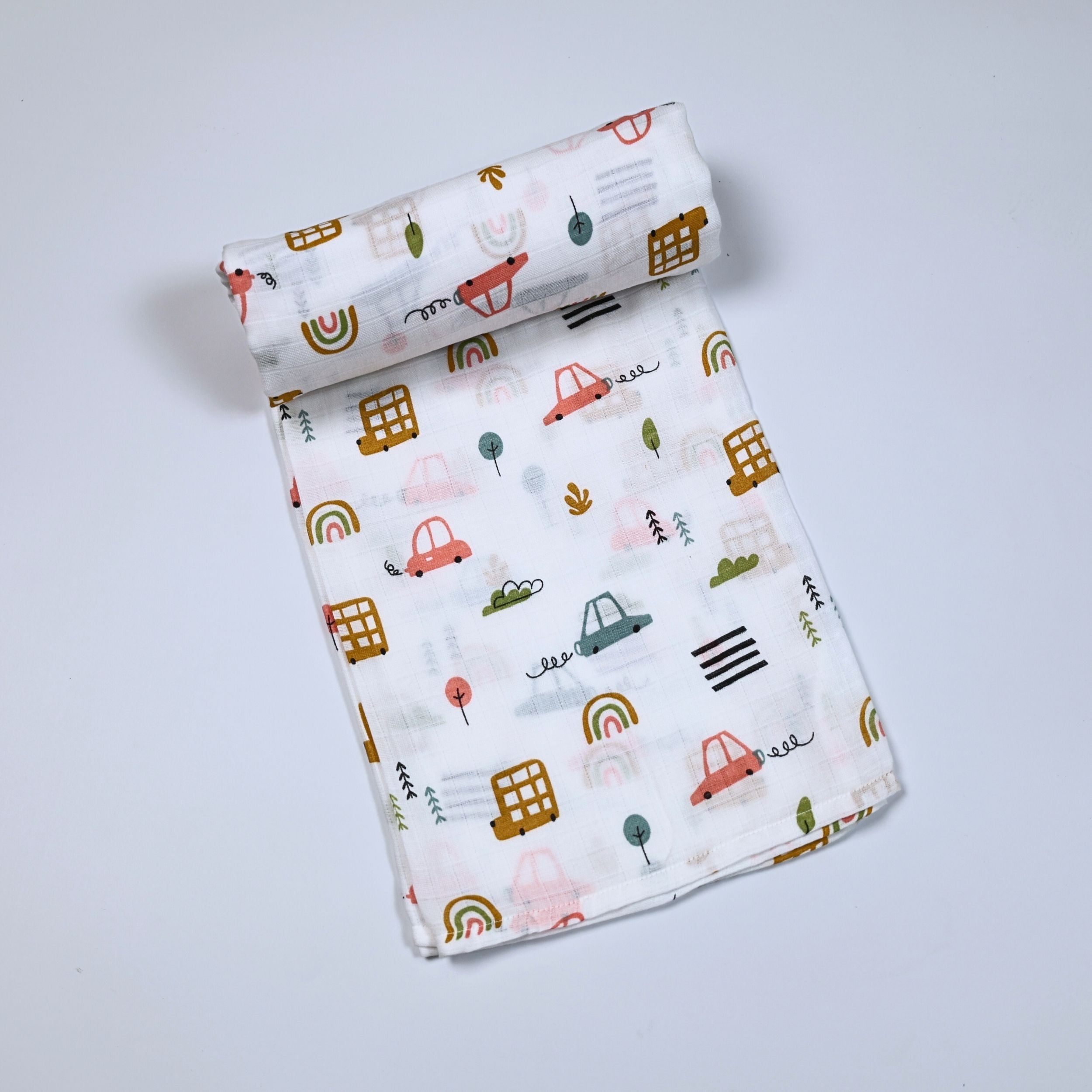 Little Wheels Baby bath towel in white, printed with rainbow and playful vehicles themed pattern