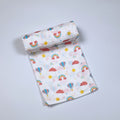 Rainbow Rides Baby bath towel in white printed with rainbow, cloud, and hot air balloon pattern