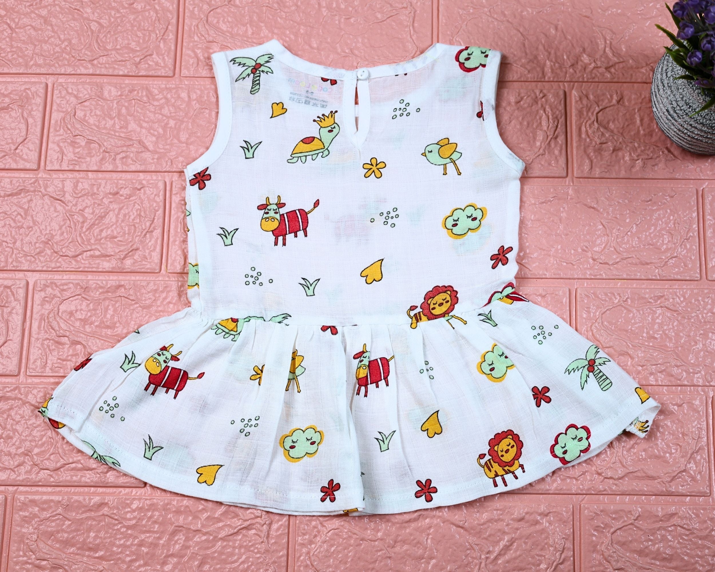 Farm Buddies baby sleeveless frock in white with snap buttons, printed with birds and animals pattern