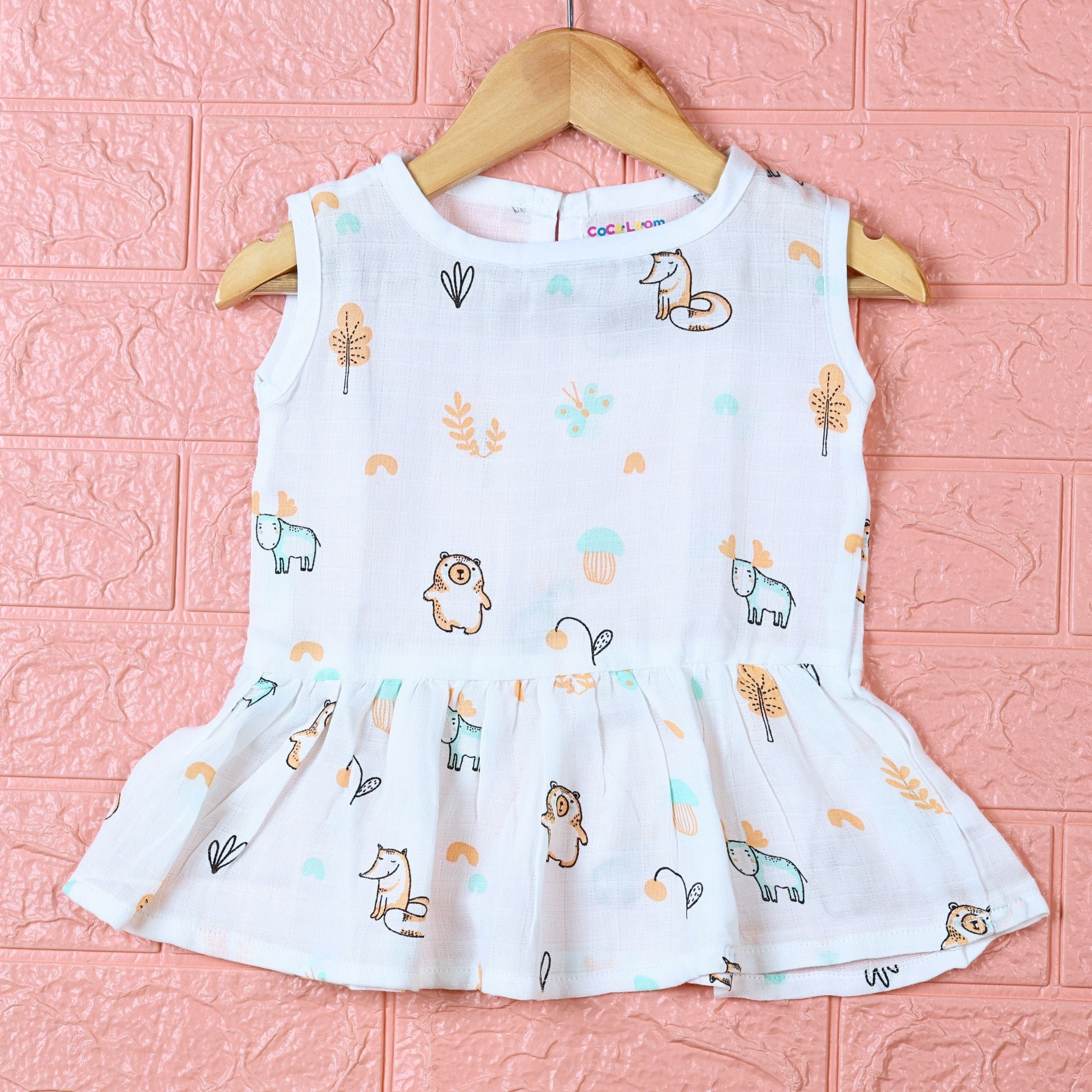 Frosty Forest Baby sleeveless frock in white with button, printed with animal prints