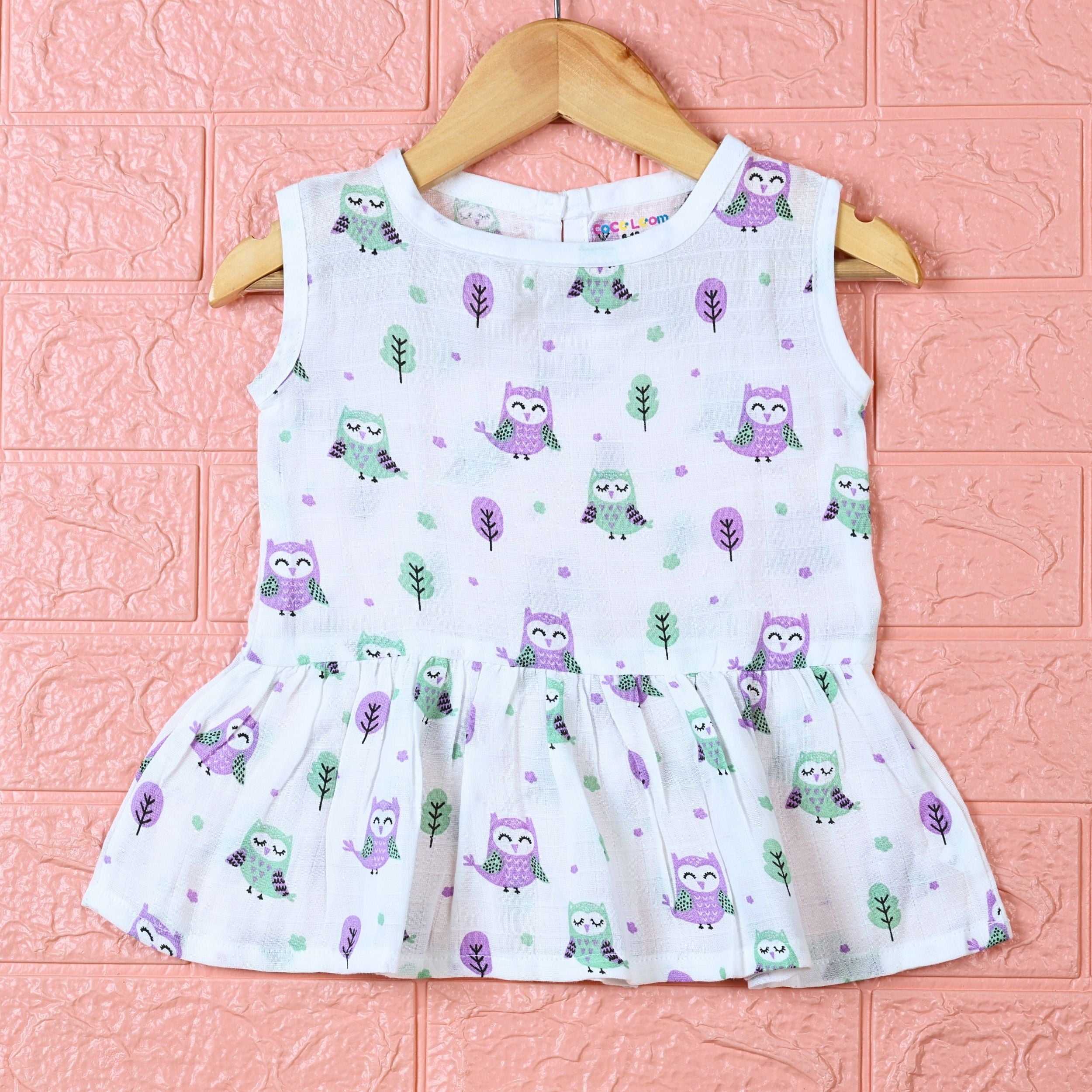 Little Hoots baby sleeveless frock in white with button printed with owl pattern