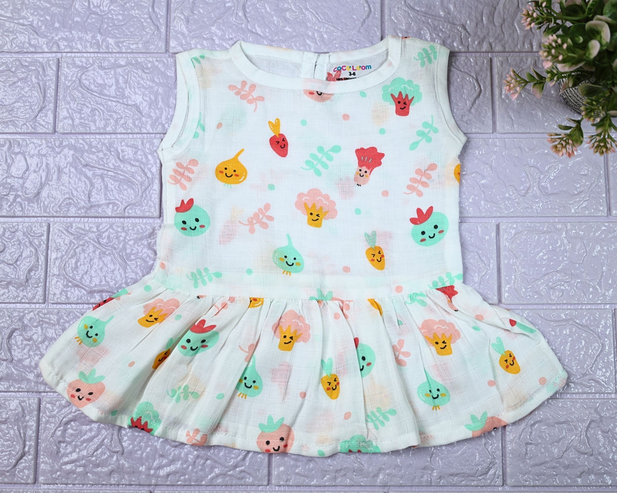 Little Veggies baby sleeveless frock in white with zip, printed with colourful veggie patterns