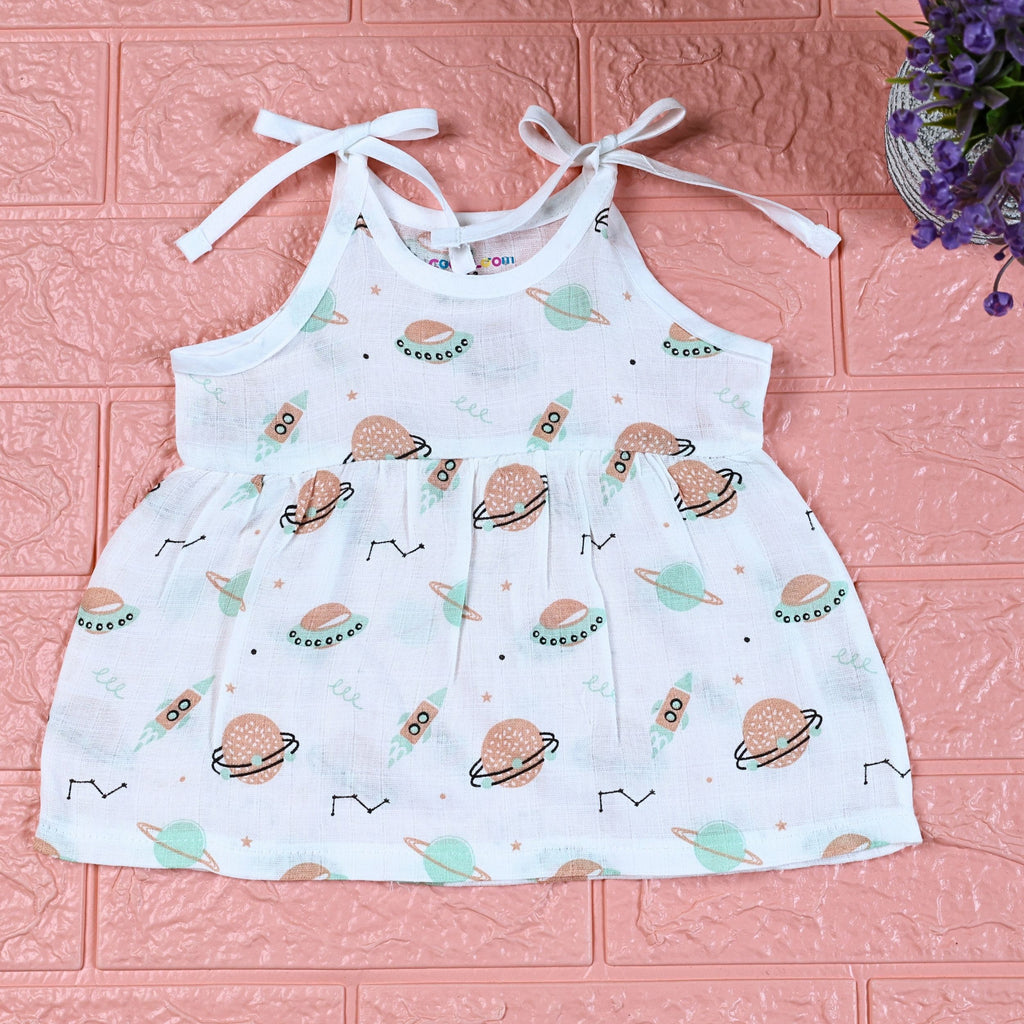 Cosmic Wonders Baby frock in white with tie up shoulders, printed with space-themed design