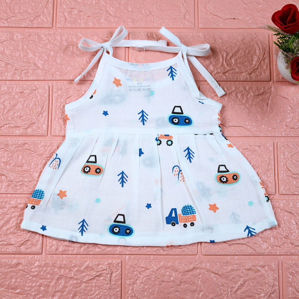 Crane Crew baby frock in white with tie up shoulders, printed with construction equipment vehicle pattern