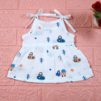 Crane Crew baby frock in white with tie up shoulders, printed with construction equipment vehicle pattern