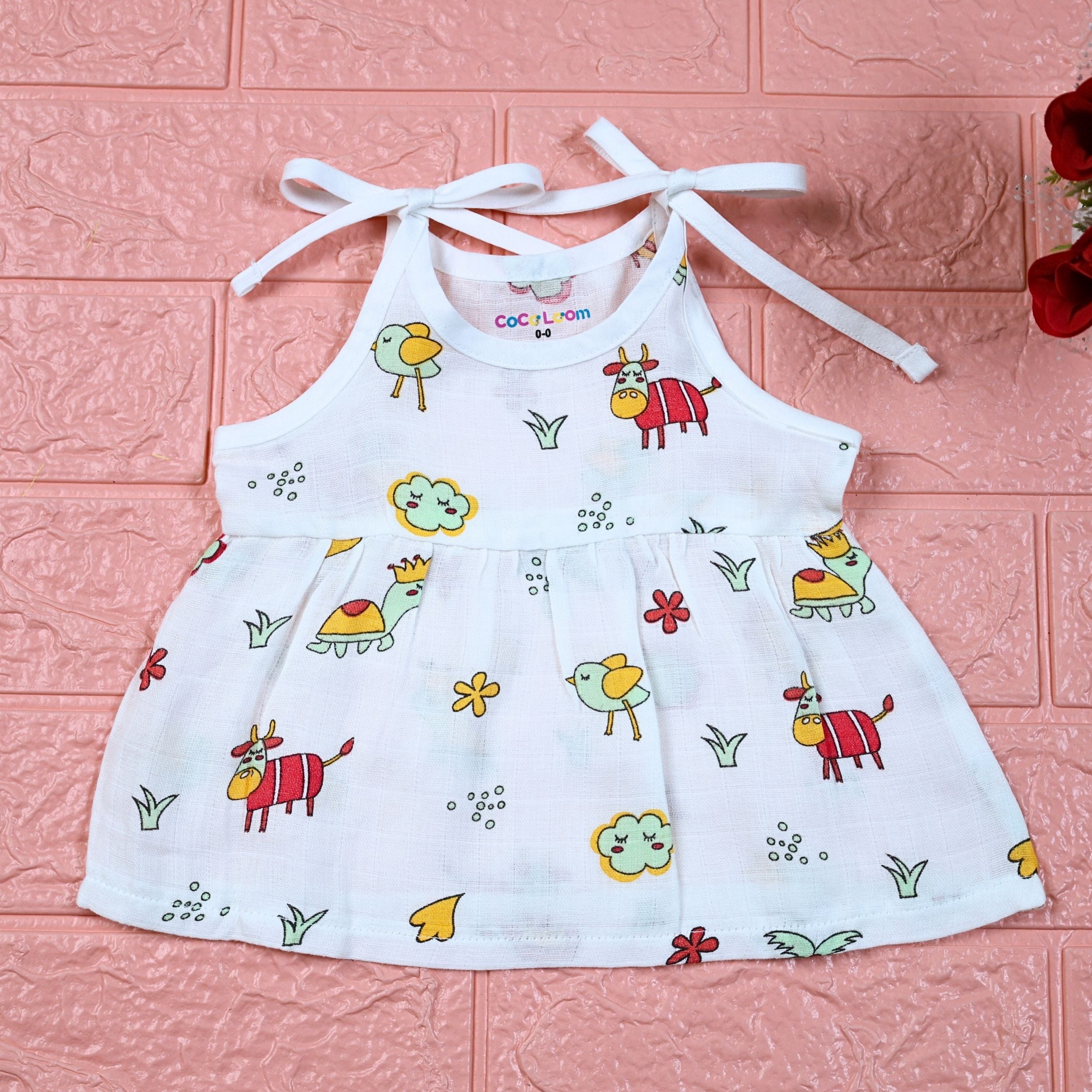 Farm Buddies baby frock in white with tie up shoulders, printed with birds and animals pattern