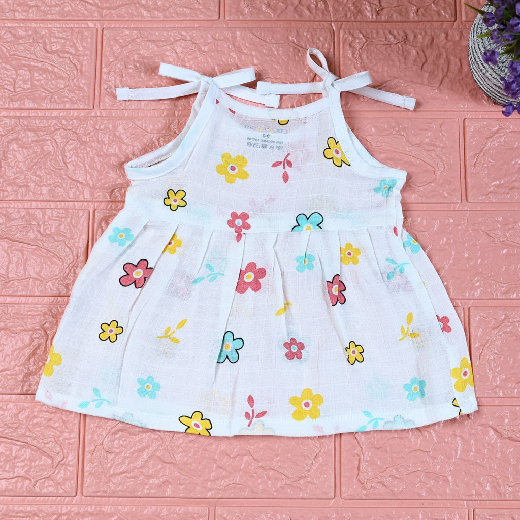 Flora Baby frock in white with tie up shoulders, printed with Floral pattern