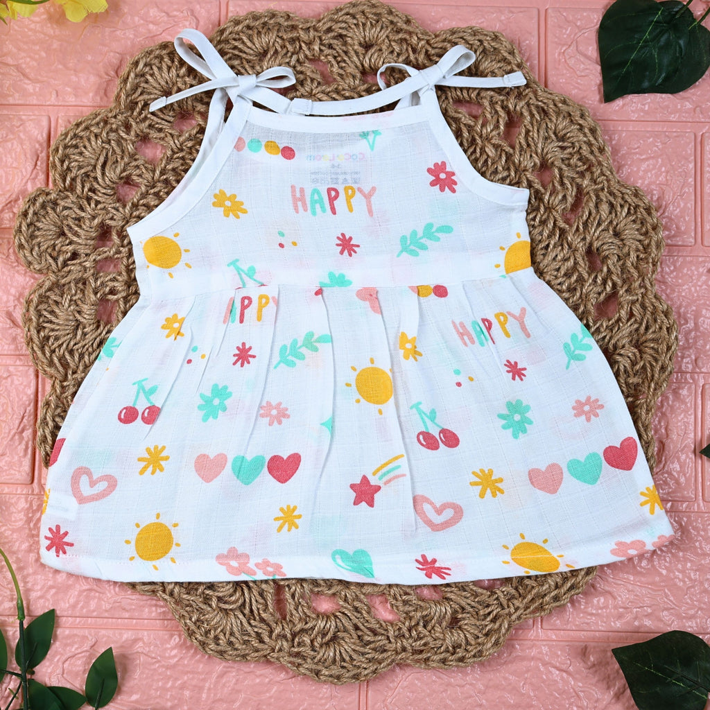 Happy Hearts baby frock in white with tie up shoulders, printed with colourful heart patterns