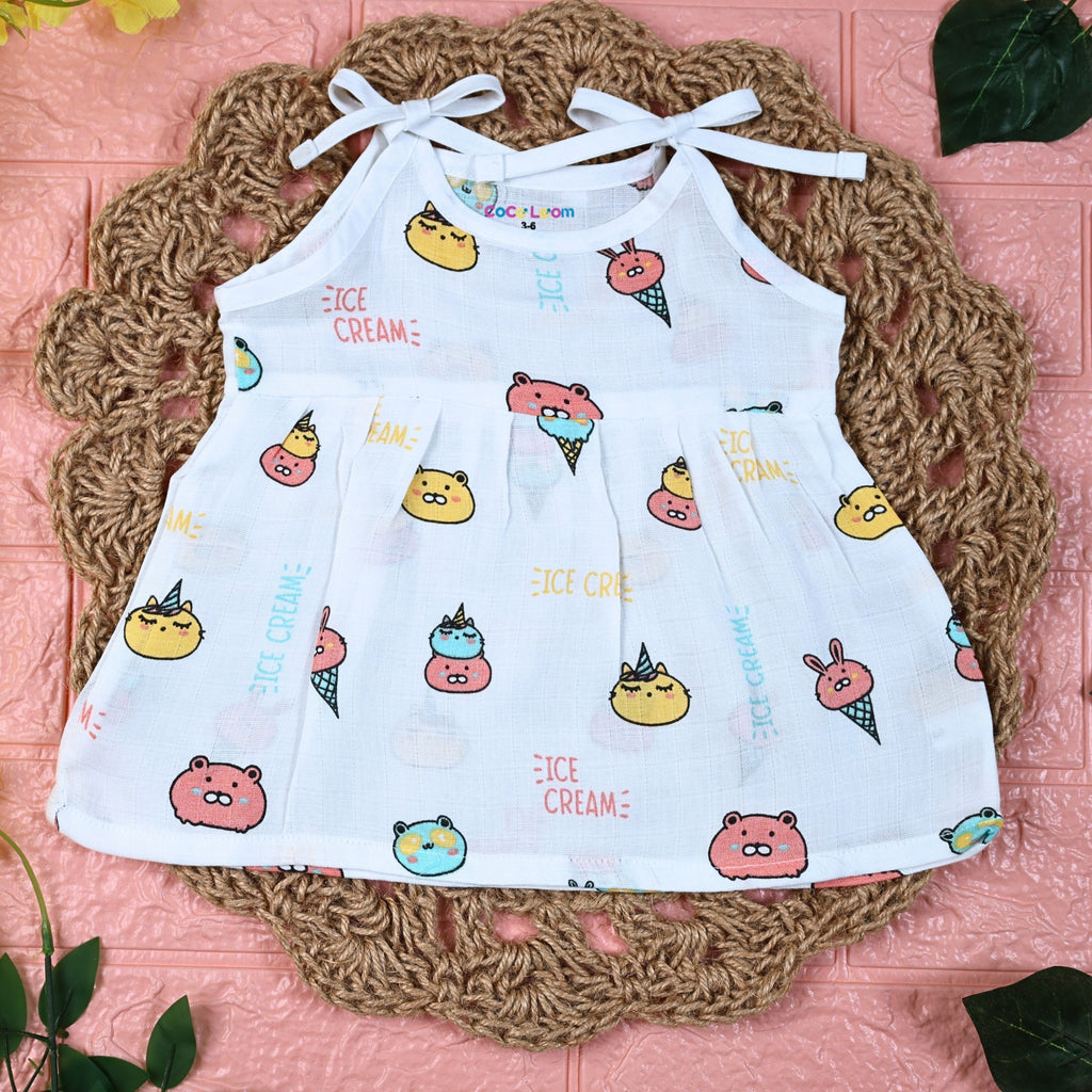 Ice-cream baby frock in white with tie up shoulders, printed with ice-cream pattern
