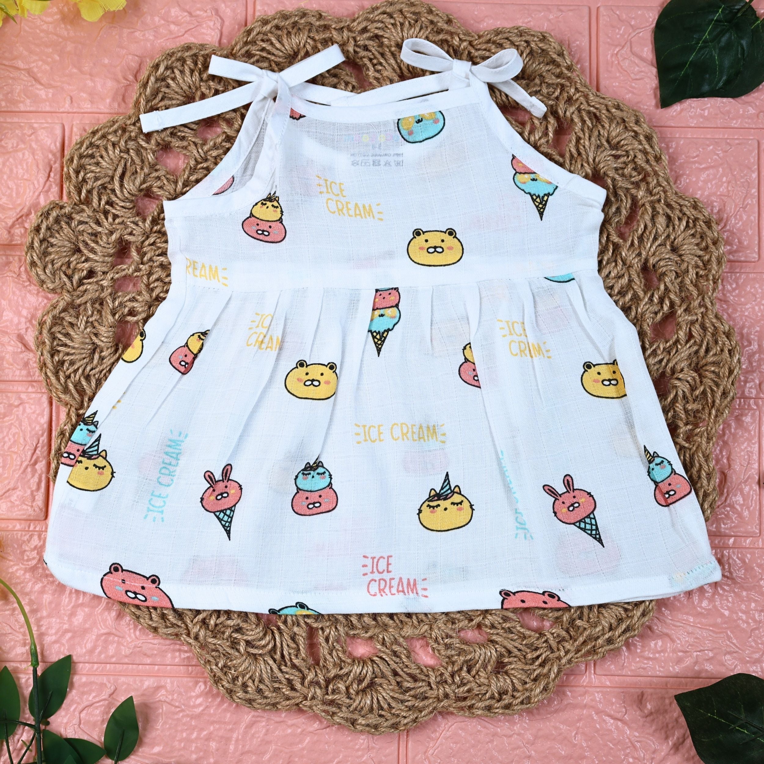 Ice-cream baby frock in white with tie up shoulders, printed with ice-cream pattern