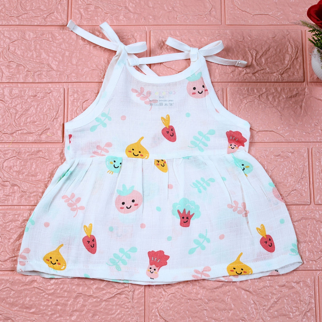 Little Veggies baby sleeveless frock in white with tie up shoulders, printed with colourful veggie patterns