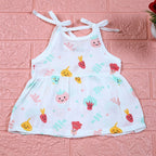 Little Veggies baby sleeveless frock in white with tie up shoulders, printed with colourful veggie patterns