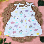 Purple Magic baby frock in white with tie up shoulders, printed with colourful patterns