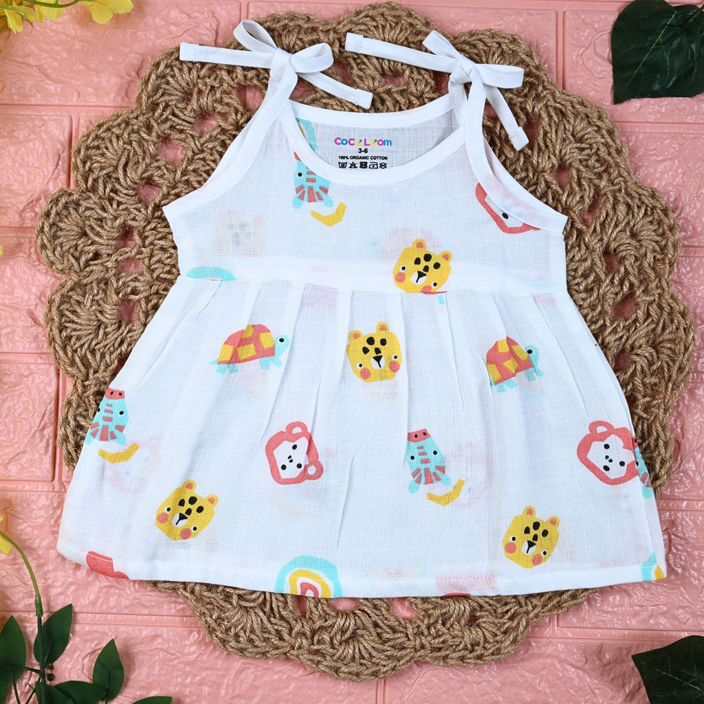 Safari Snuggles Baby frock in white with tie up shoulders, printed with colorful jungle animal pattern