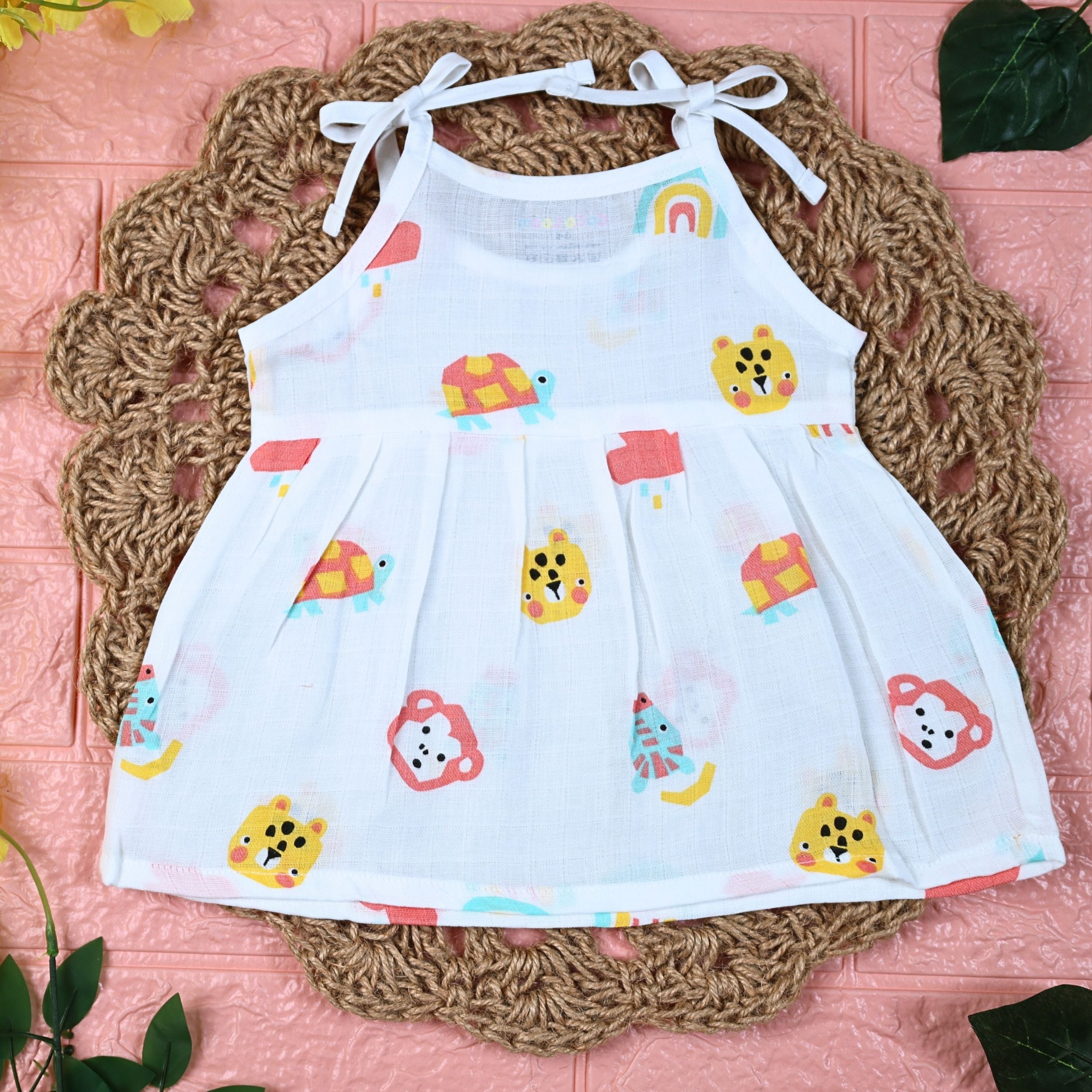 Safari Snuggles Baby frock in white with tie up shoulders, printed with colorful jungle animal pattern
