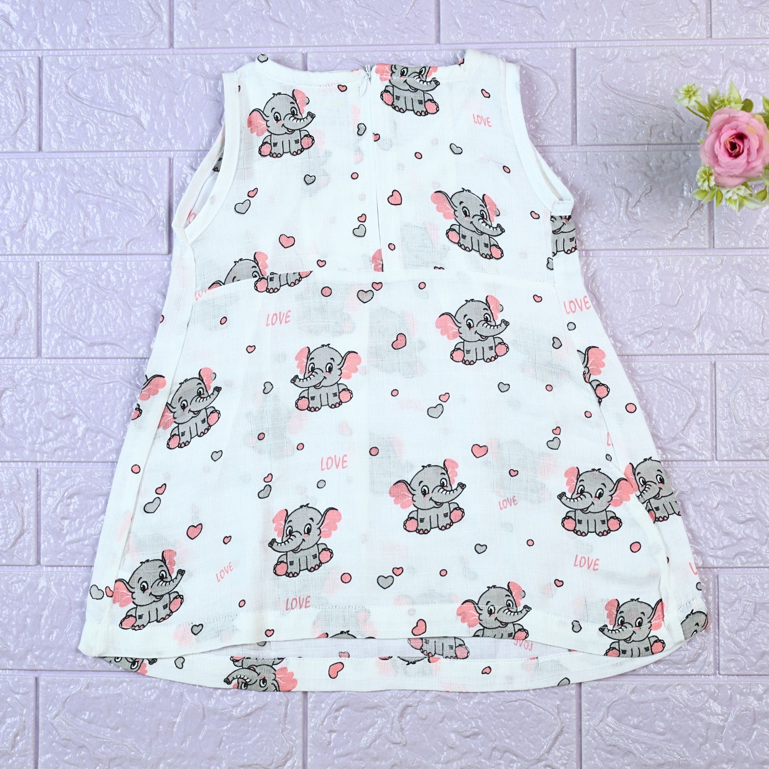 Baby Elly Baby sleeveless frock in white with zip, printed with elephant pattern