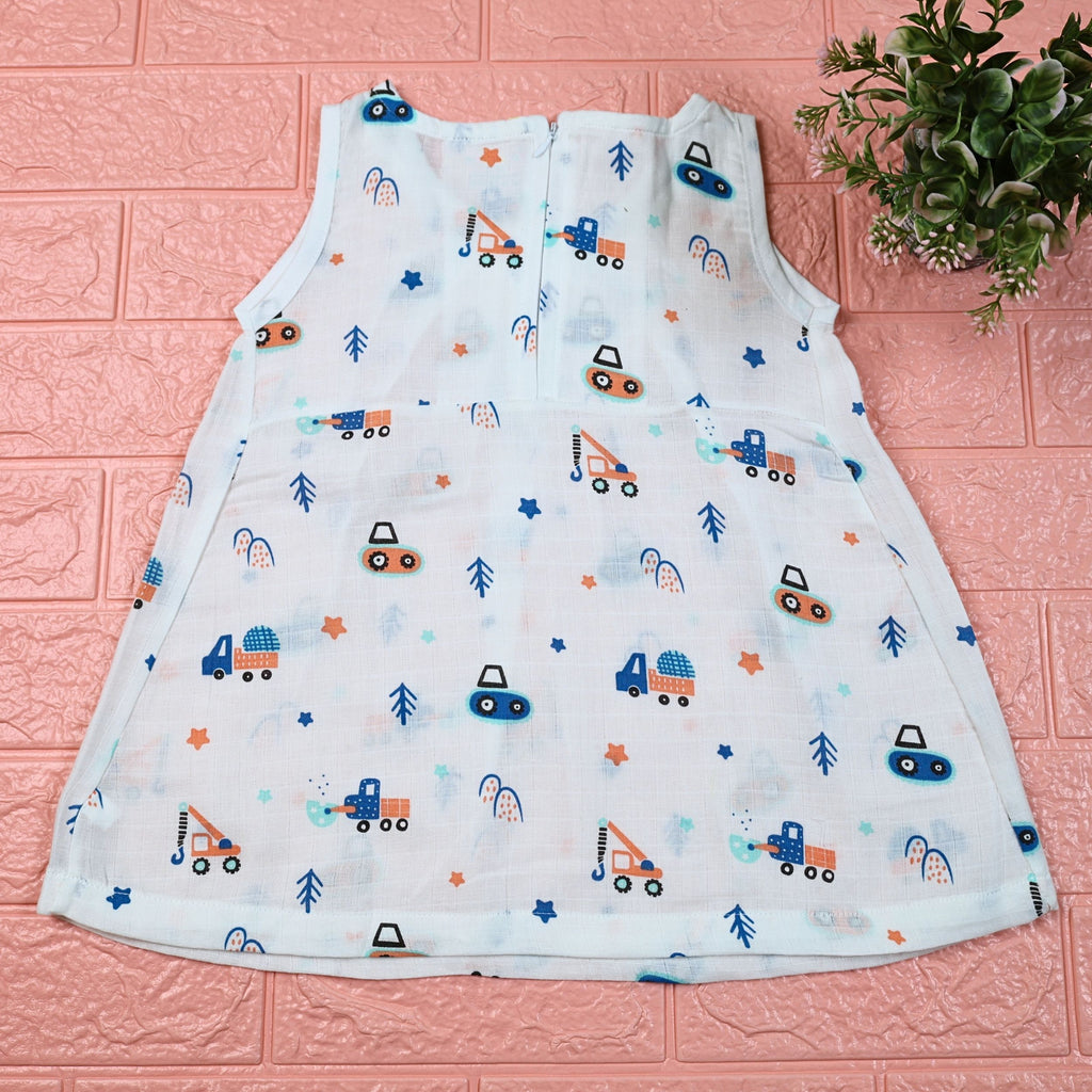 Crane Crew baby sleeveless frock in white with zip, printed with construction equipment vehicle pattern