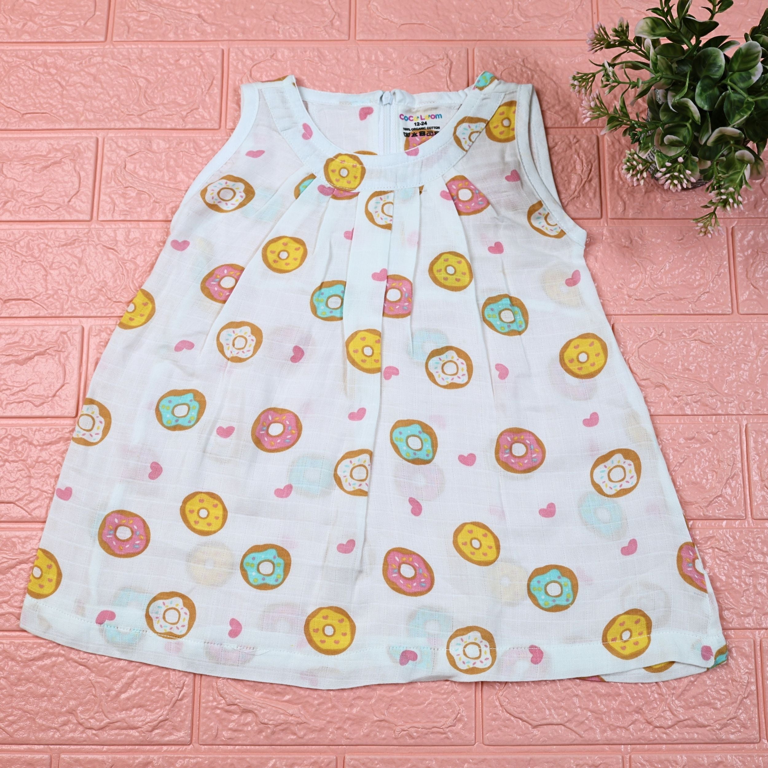 Donuts Baby sleeveless white frock with zip, printed with donut pattern