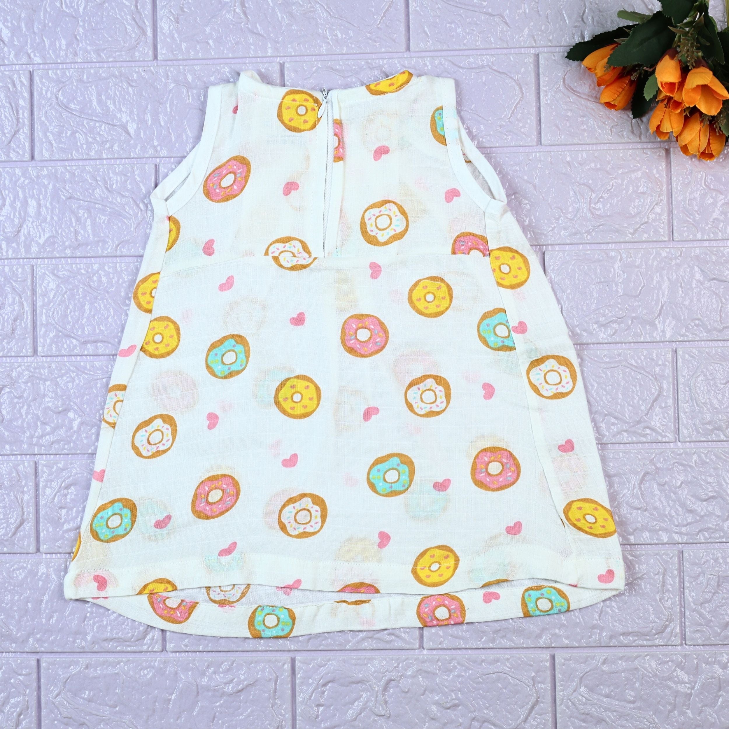 Donuts Baby sleeveless white frock with zip, printed with donut pattern