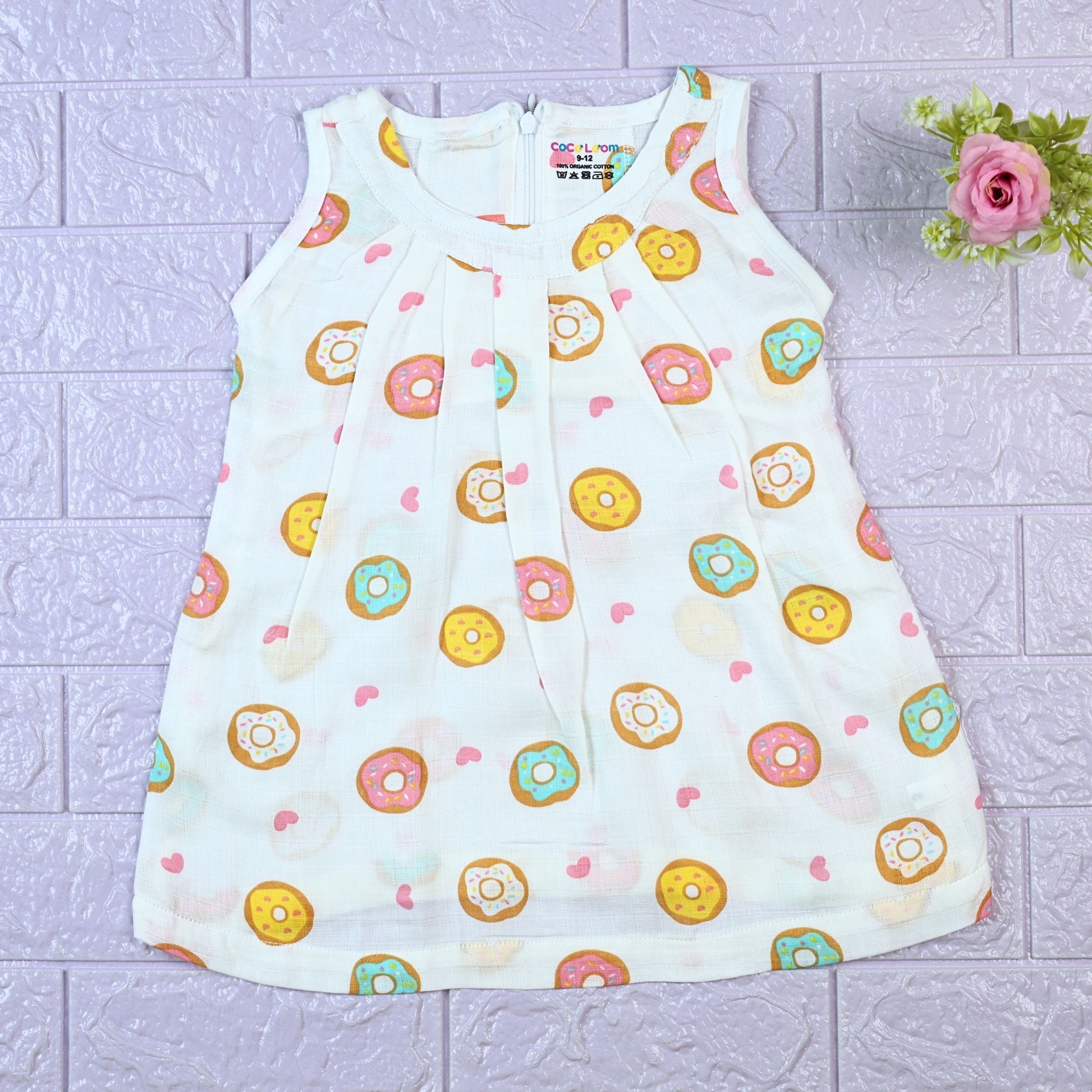 Donuts Baby sleeveless white frock with snap buttons printed with donut pattern