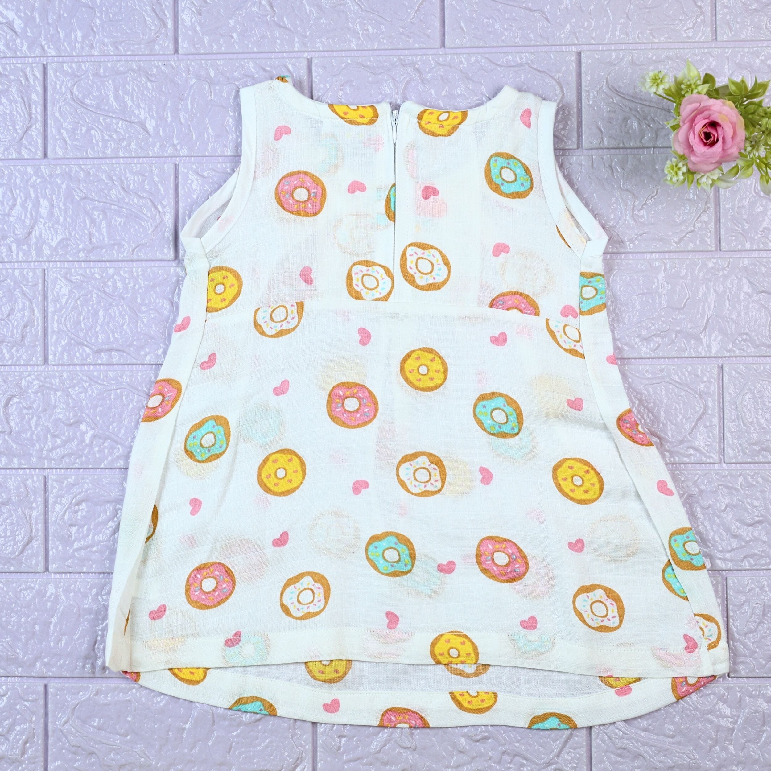 Donuts Baby sleeveless white frock with snap buttons printed with donut pattern