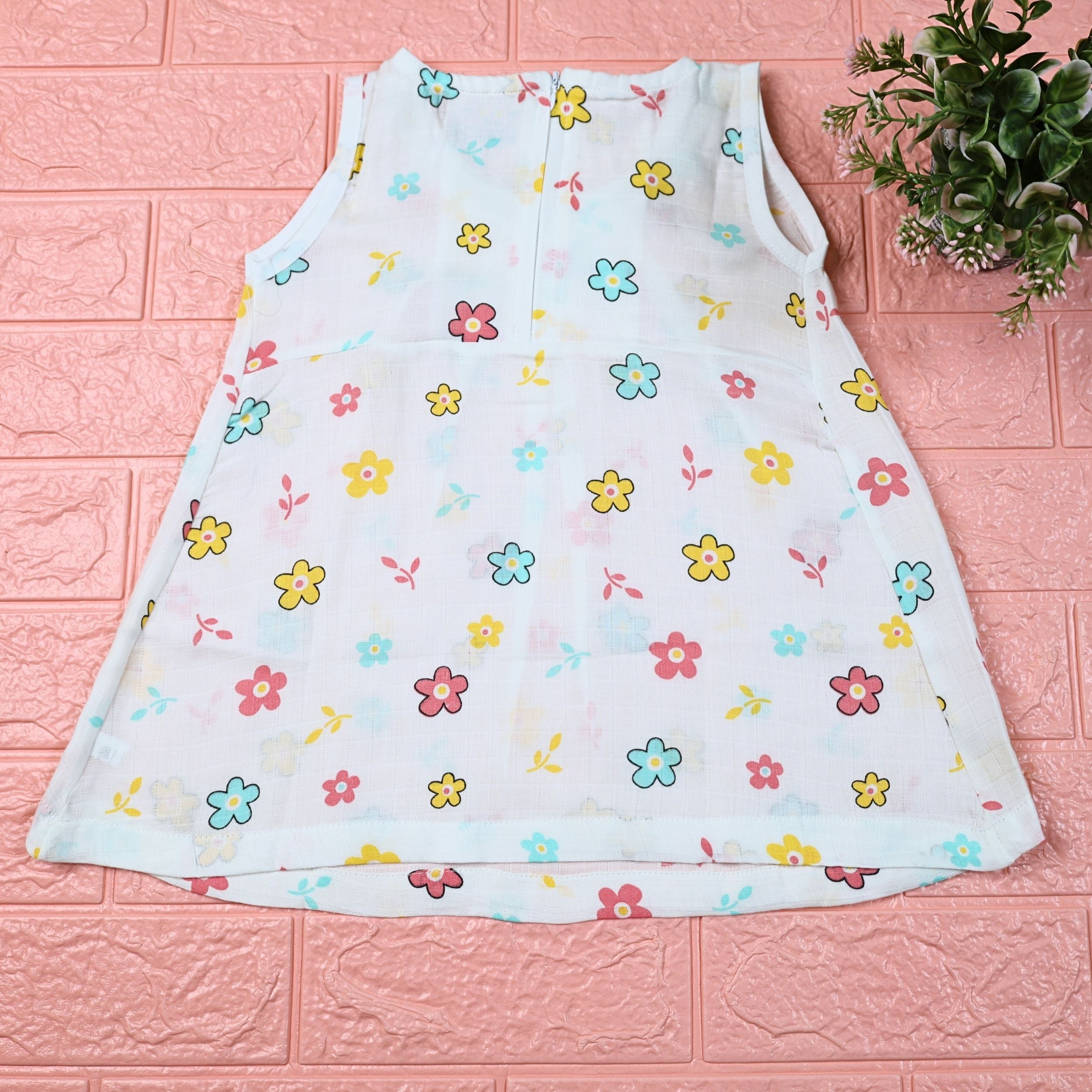 Flora Baby sleeveless frock in white with zip, printed with Floral pattern