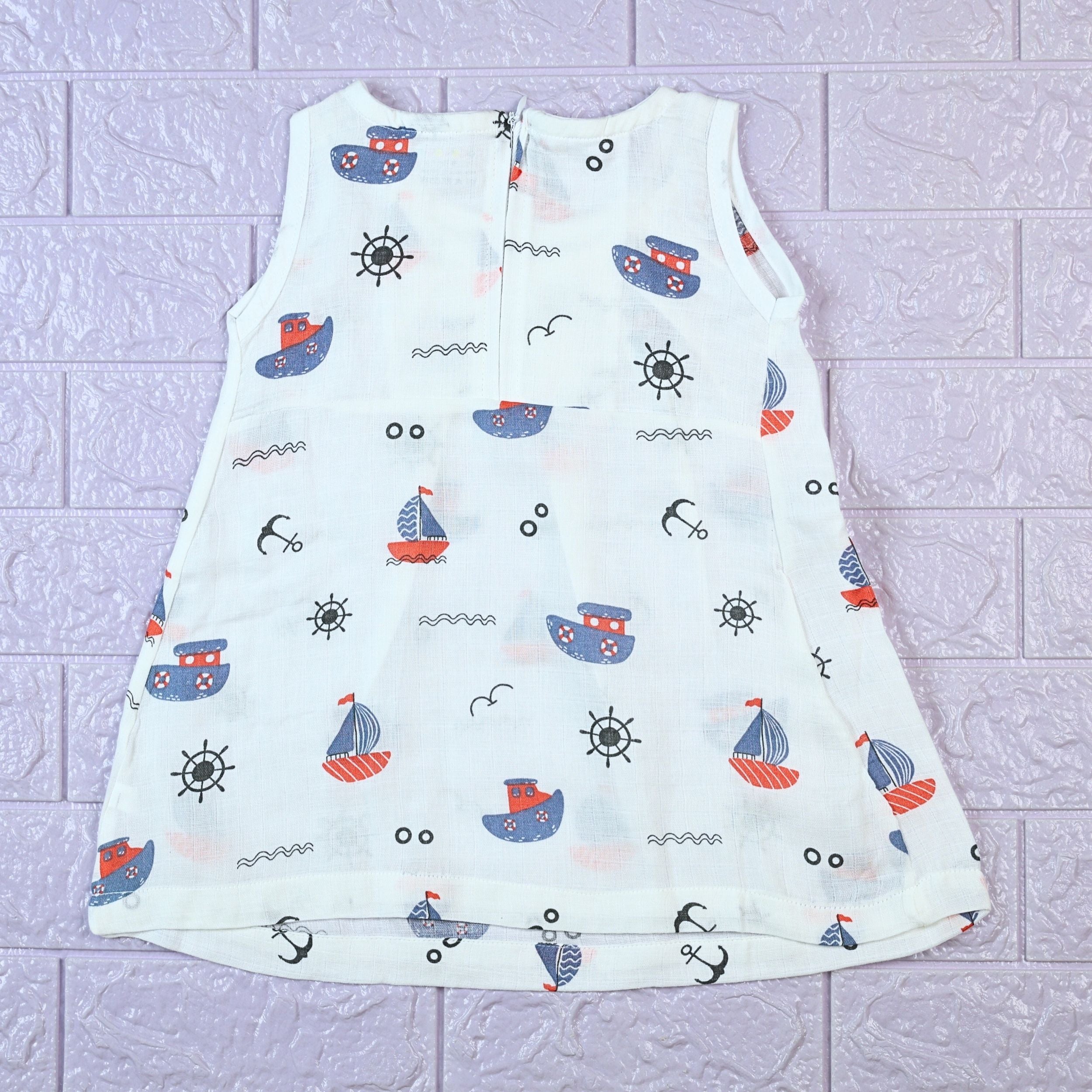 Mini Mariners baby sleeveless frock in white with zip, printed with nautical patterns