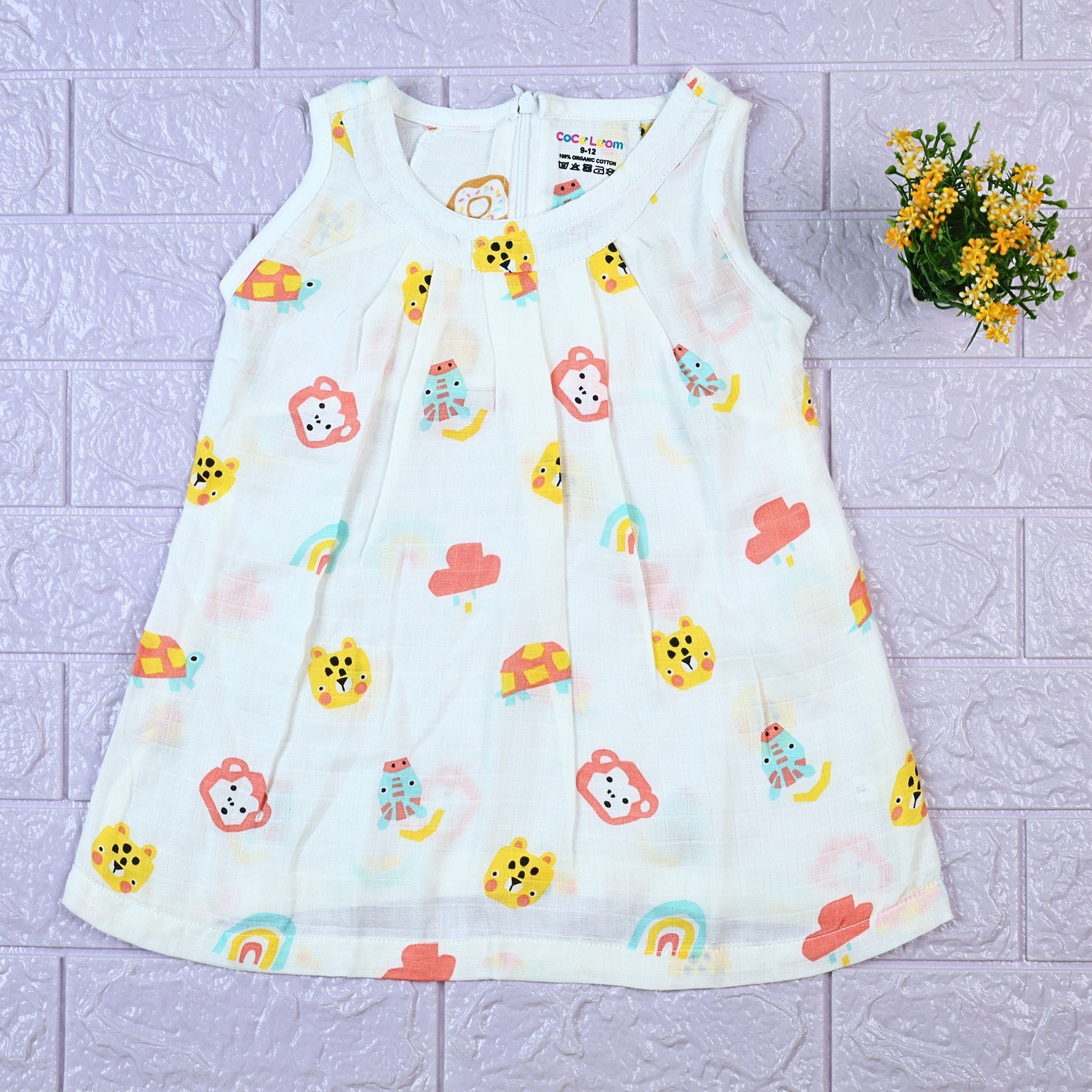 Safari Snuggles Baby sleeveless frock in white with zip, printed with colorful jungle animal pattern