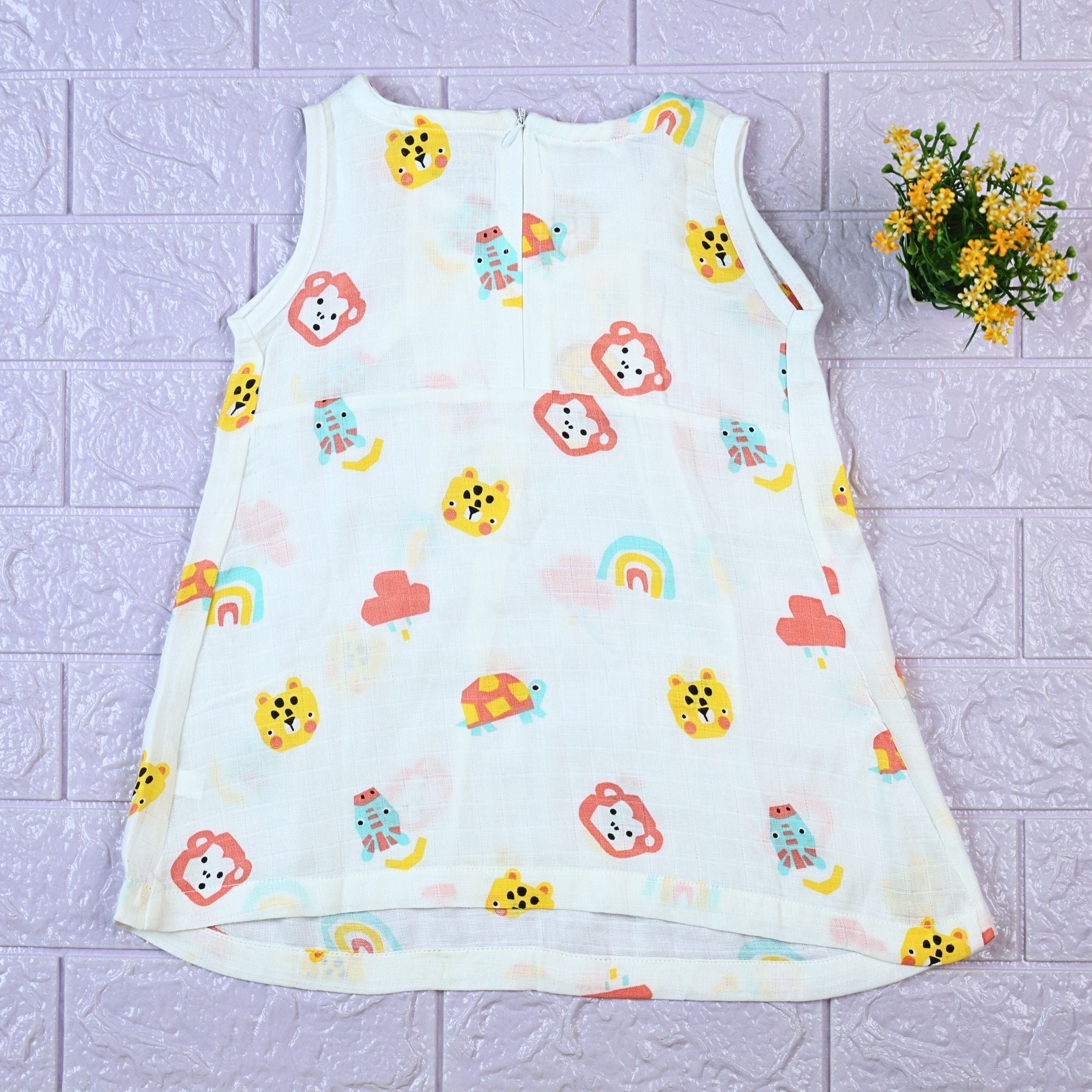 Safari Snuggles Baby sleeveless frock in white with zip, printed with colorful jungle animal pattern