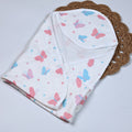 Butterfly Blush baby hooded towel
 in white printed with pastel butterfly motifs in soft pink and blue tones.
