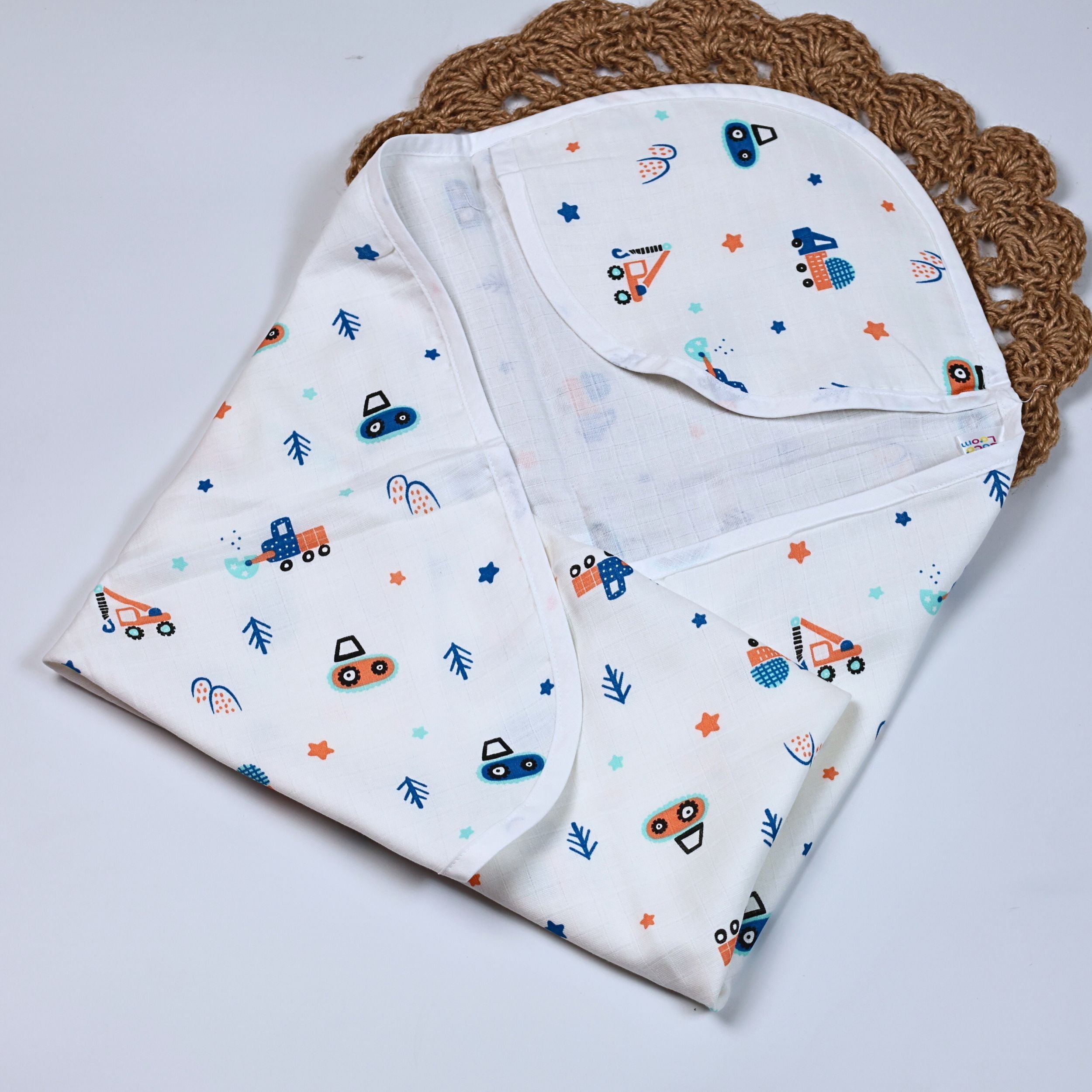 Crane Crew baby hooded towel in white, printed with construction equipment vehicle pattern