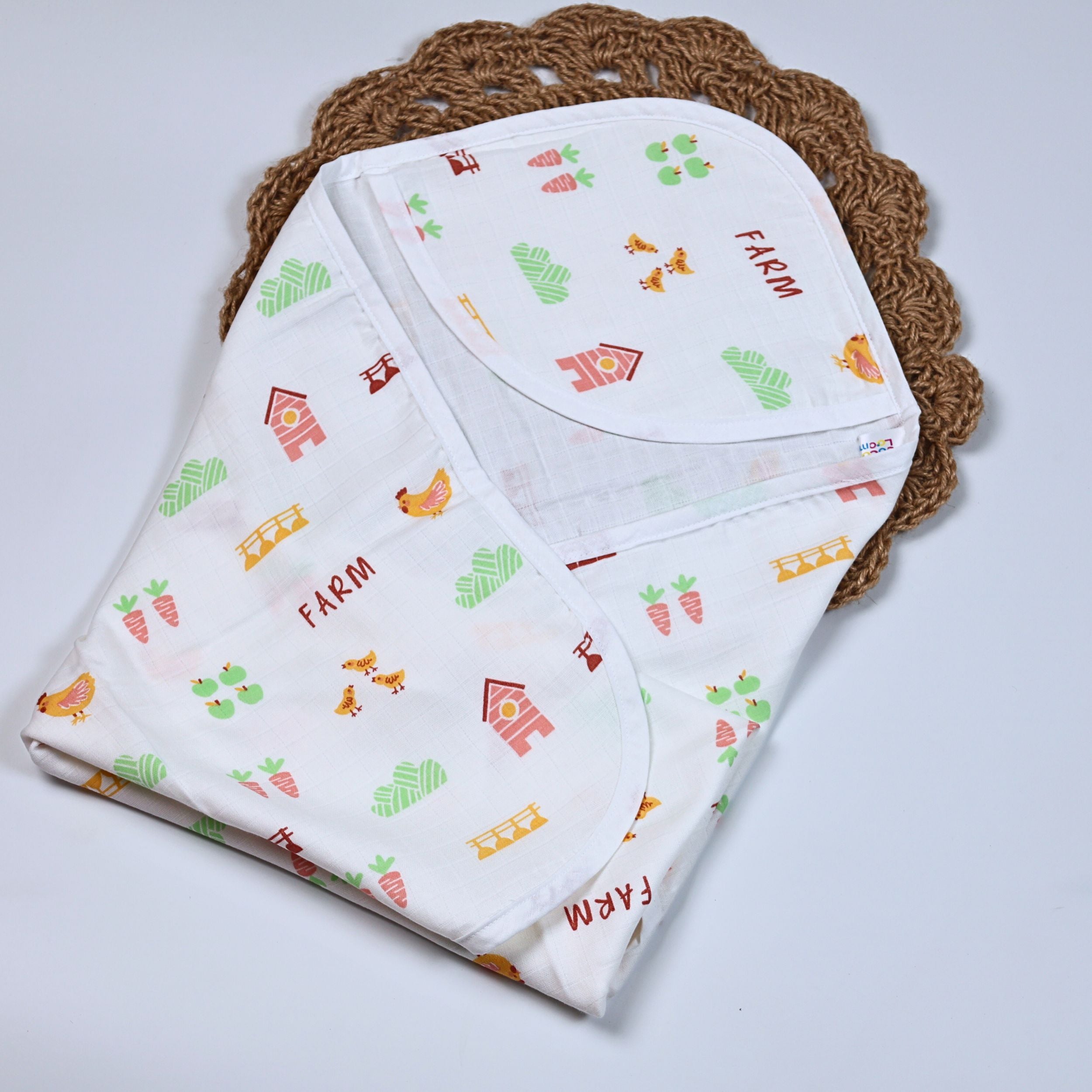 Farm Tales Baby hooded towel in white printed with farm-themed pattern