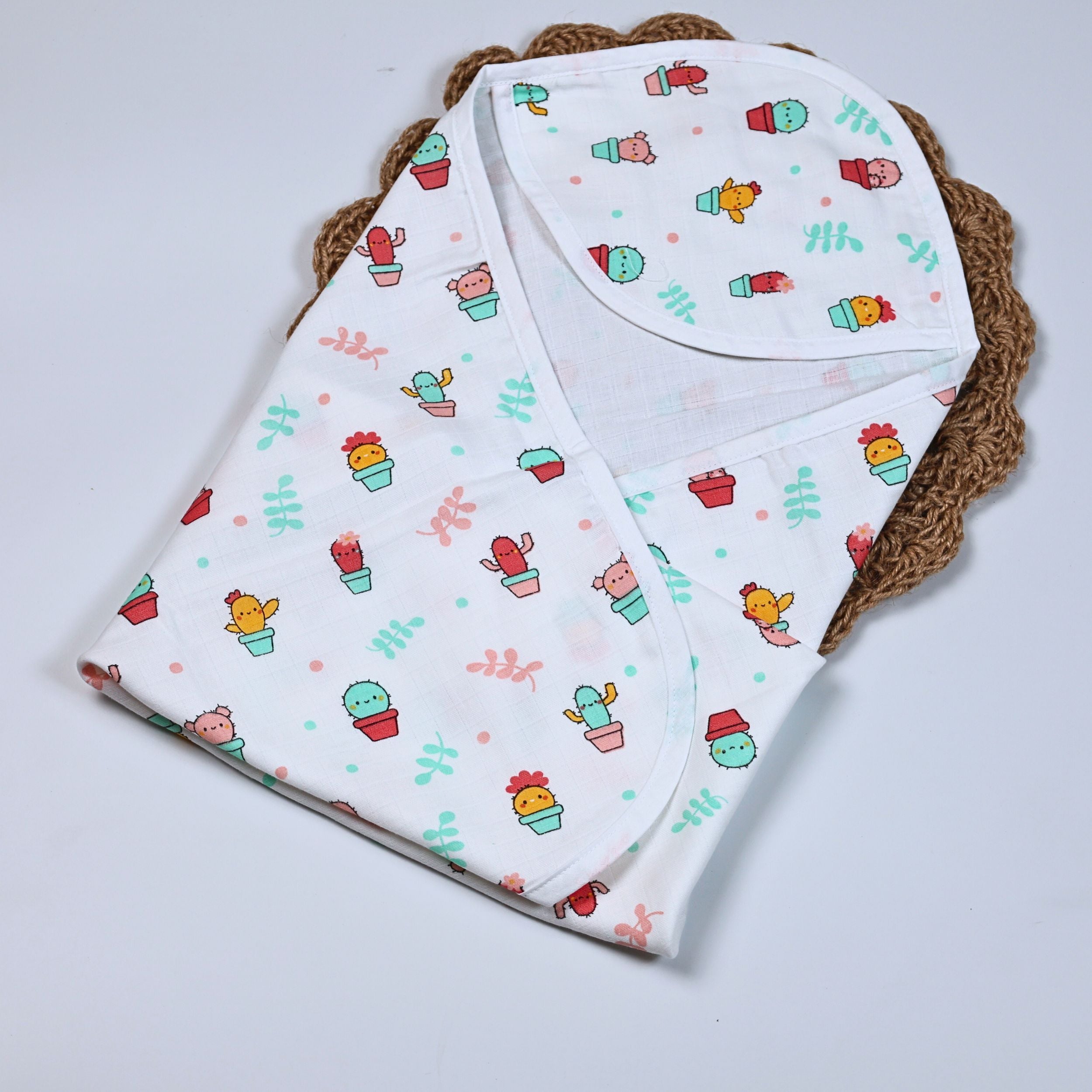 Little Cactus Baby hooded towel in white printed with colourful cactus plants pattern