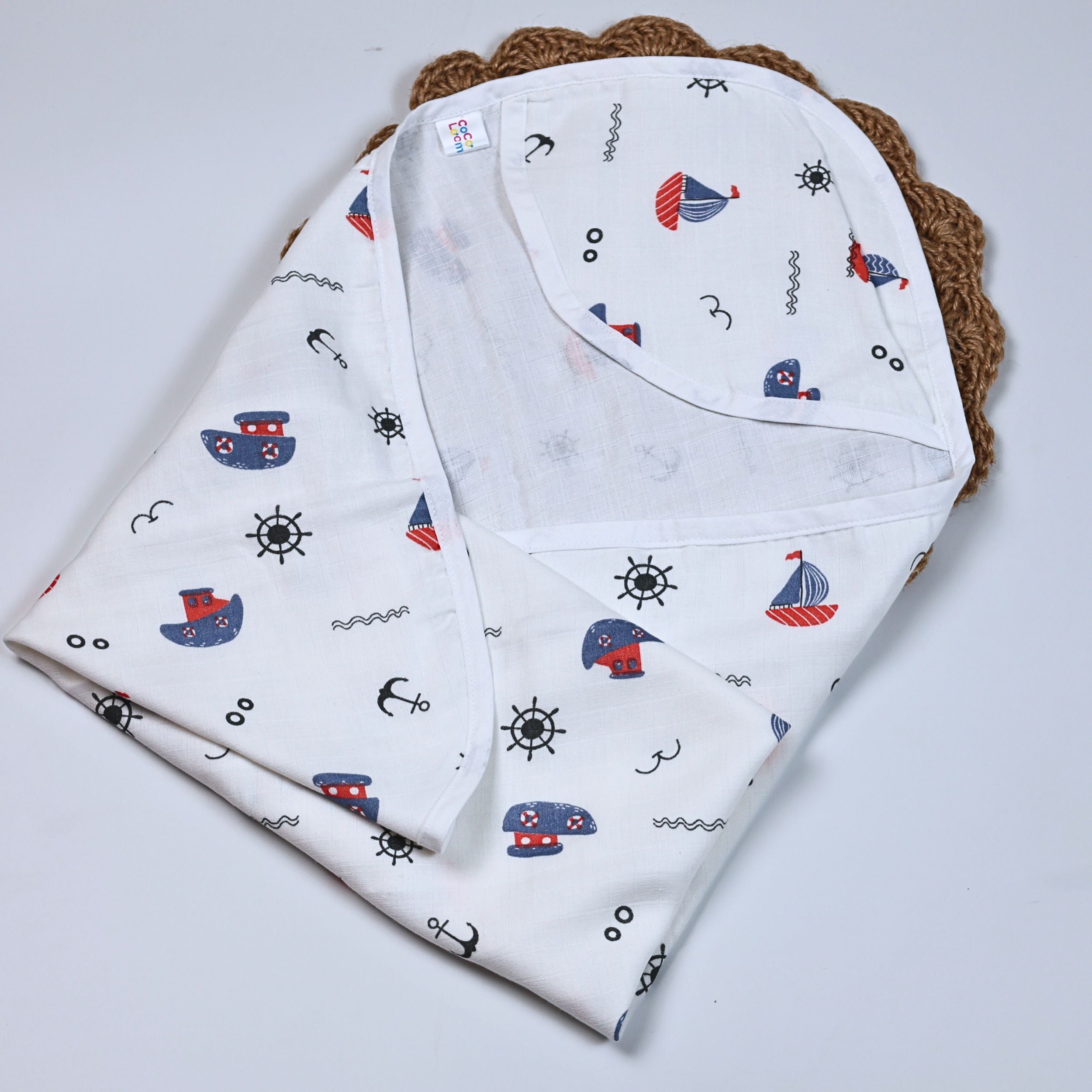 
Mini Mariners baby hooded towel in white, printed with nautical patterns