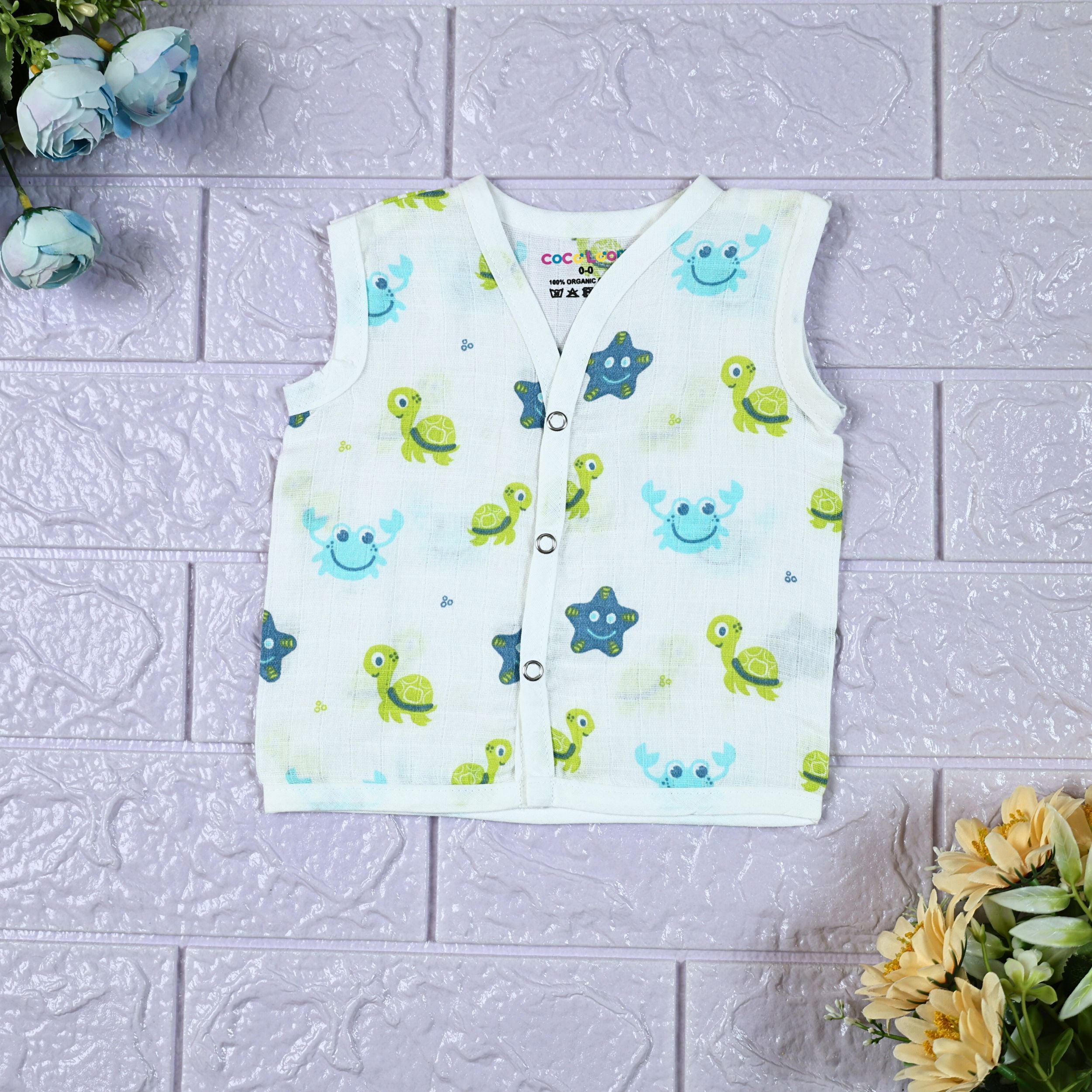 Aqua Babies baby sleeveless top in white with snap buttons printed with turtle and starfish pattern