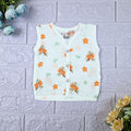 Citrus Bloom Baby sleeveless top in white with snap buttons, printed with orange floral patterns