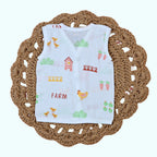 Farm Tales Baby sleeveless top in white with snap buttons printed with farm-themed pattern