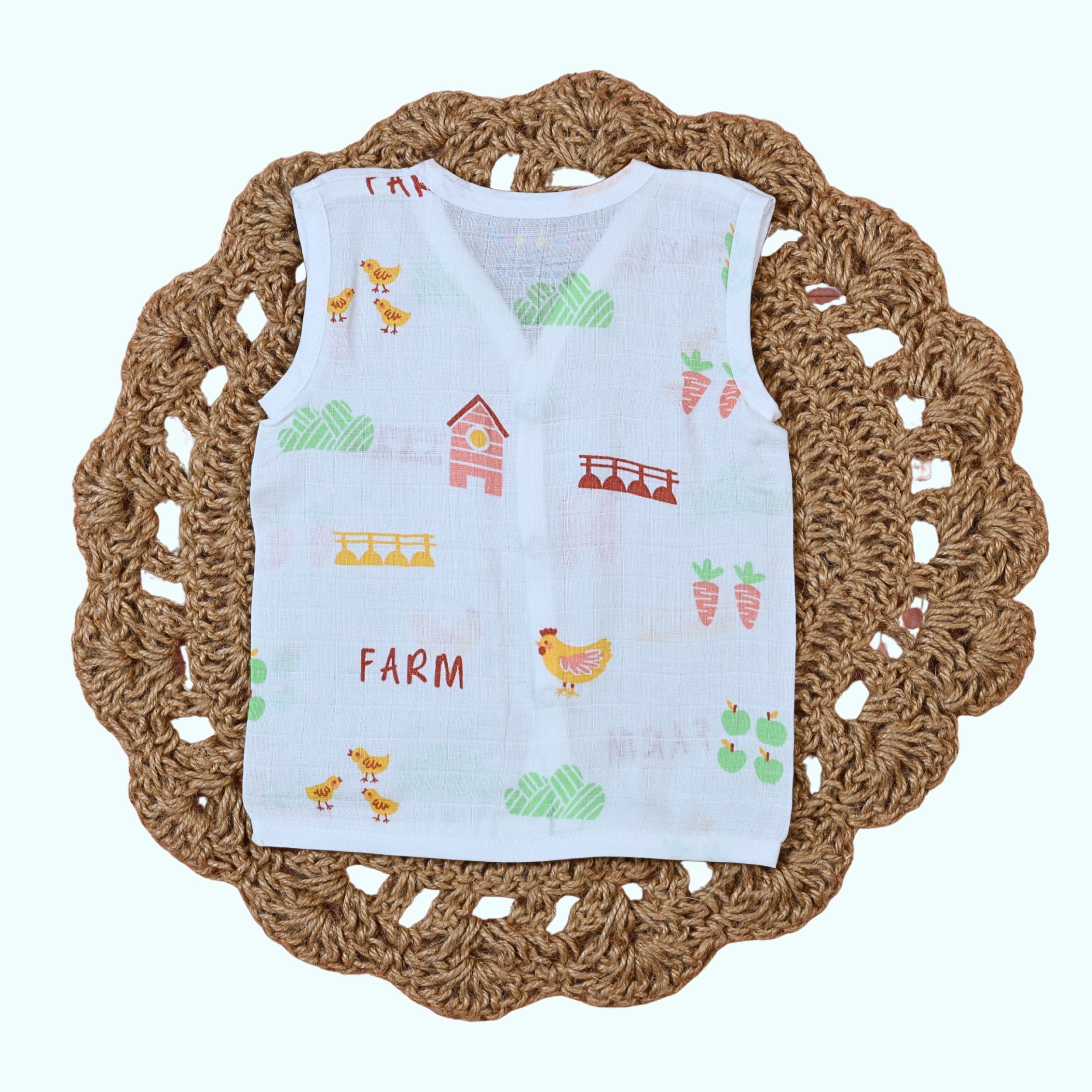 Farm Tales Baby sleeveless top in white with snap buttons printed with farm-themed pattern