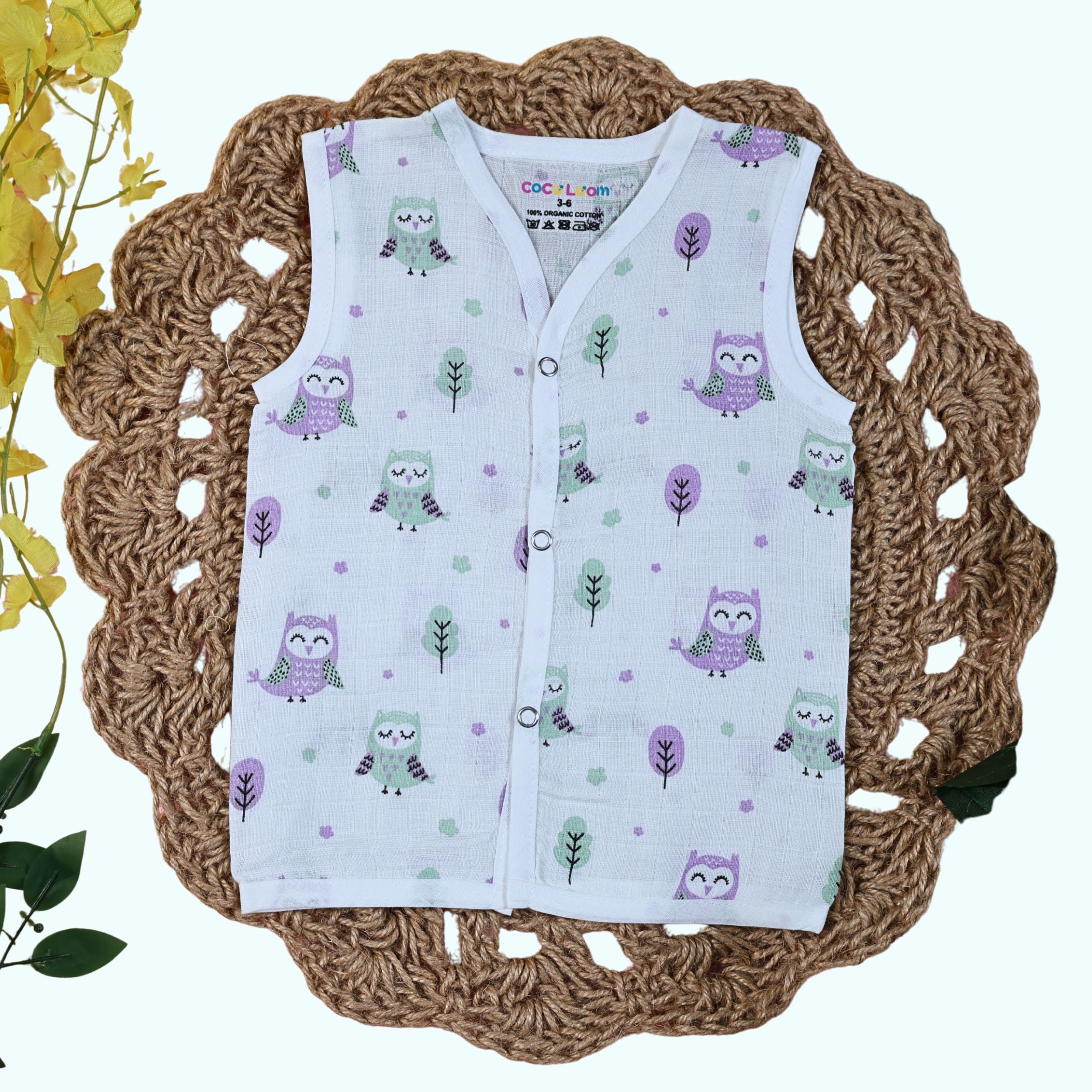 Little Hoots baby sleeveless top in white with snap buttons printed with owl pattern