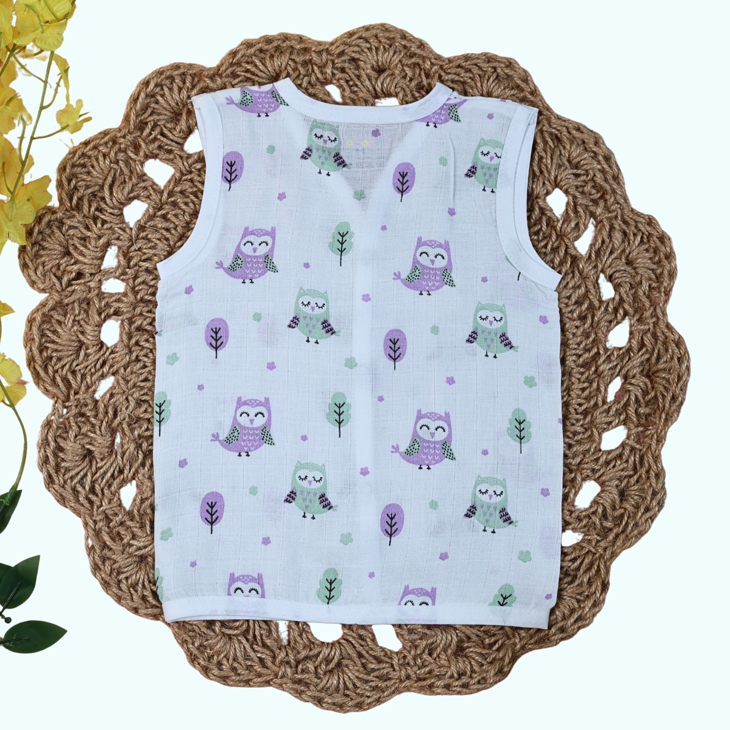Little Hoots baby sleeveless top in white with snap buttons printed with owl pattern