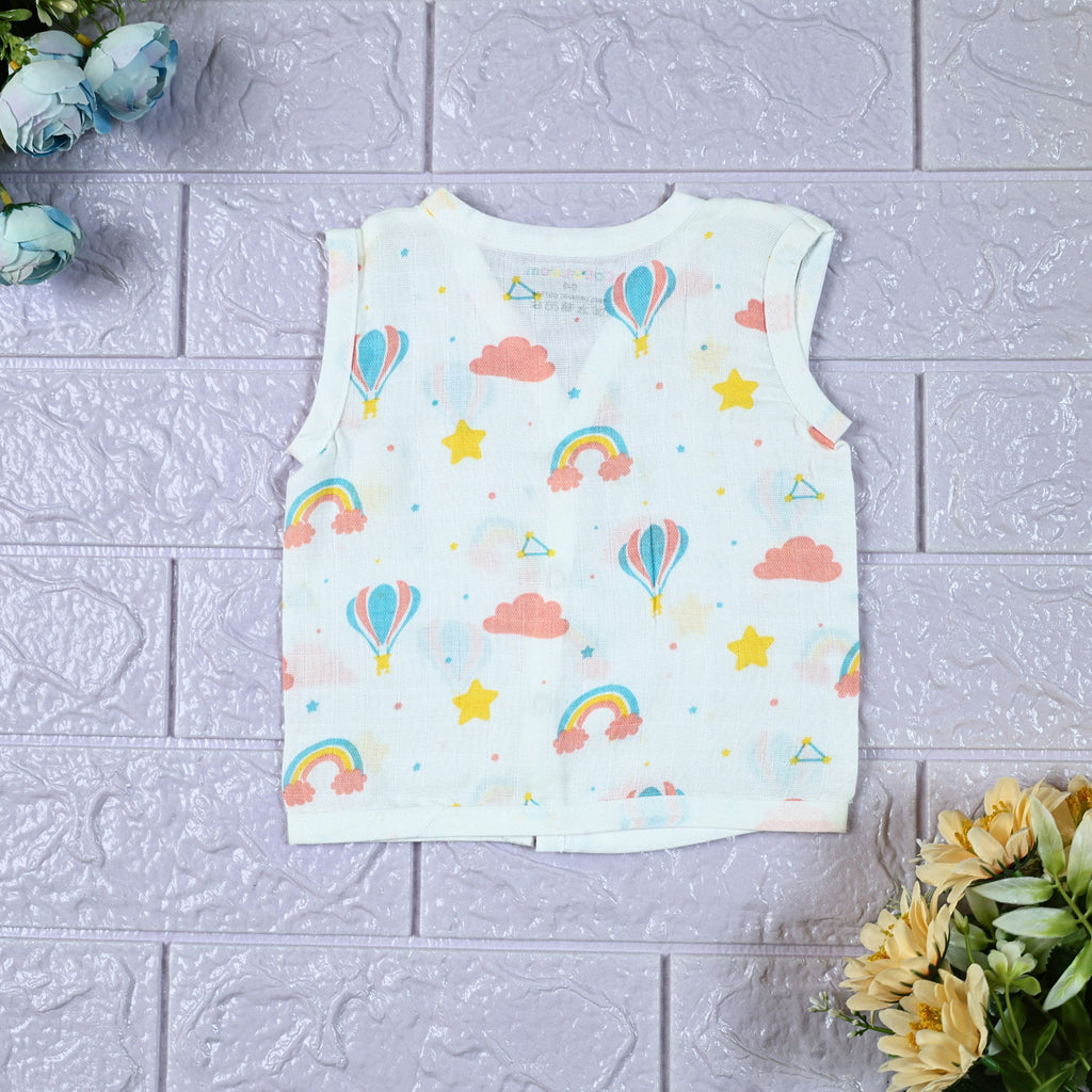 Rainbow Rides baby sleeveless top in white with snap buttons, printed with rainbows, air balloons, clouds, and stars.