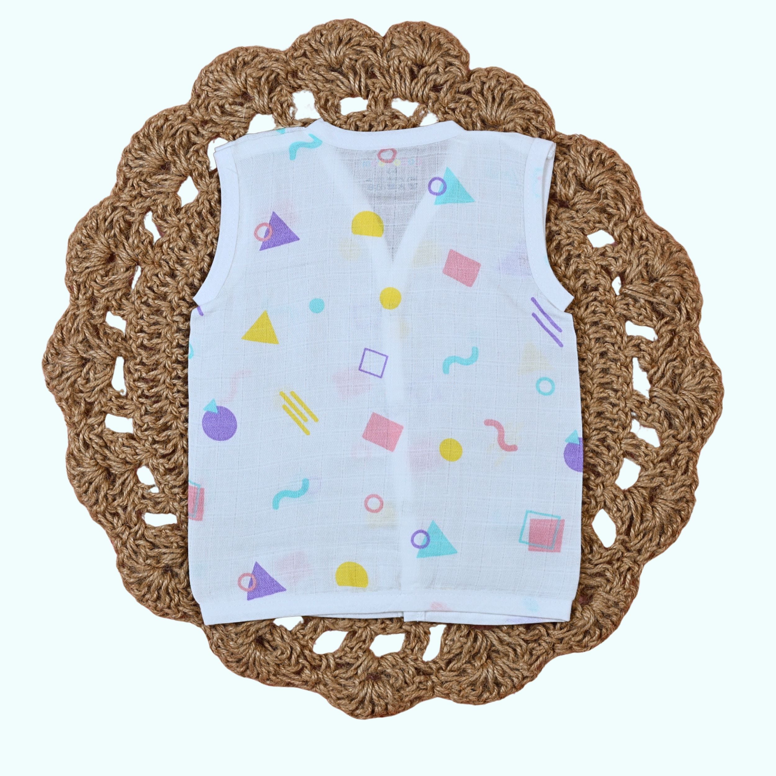 Shape Pops baby sleeveless top in white with snap buttons printed with colorful geometric pattern