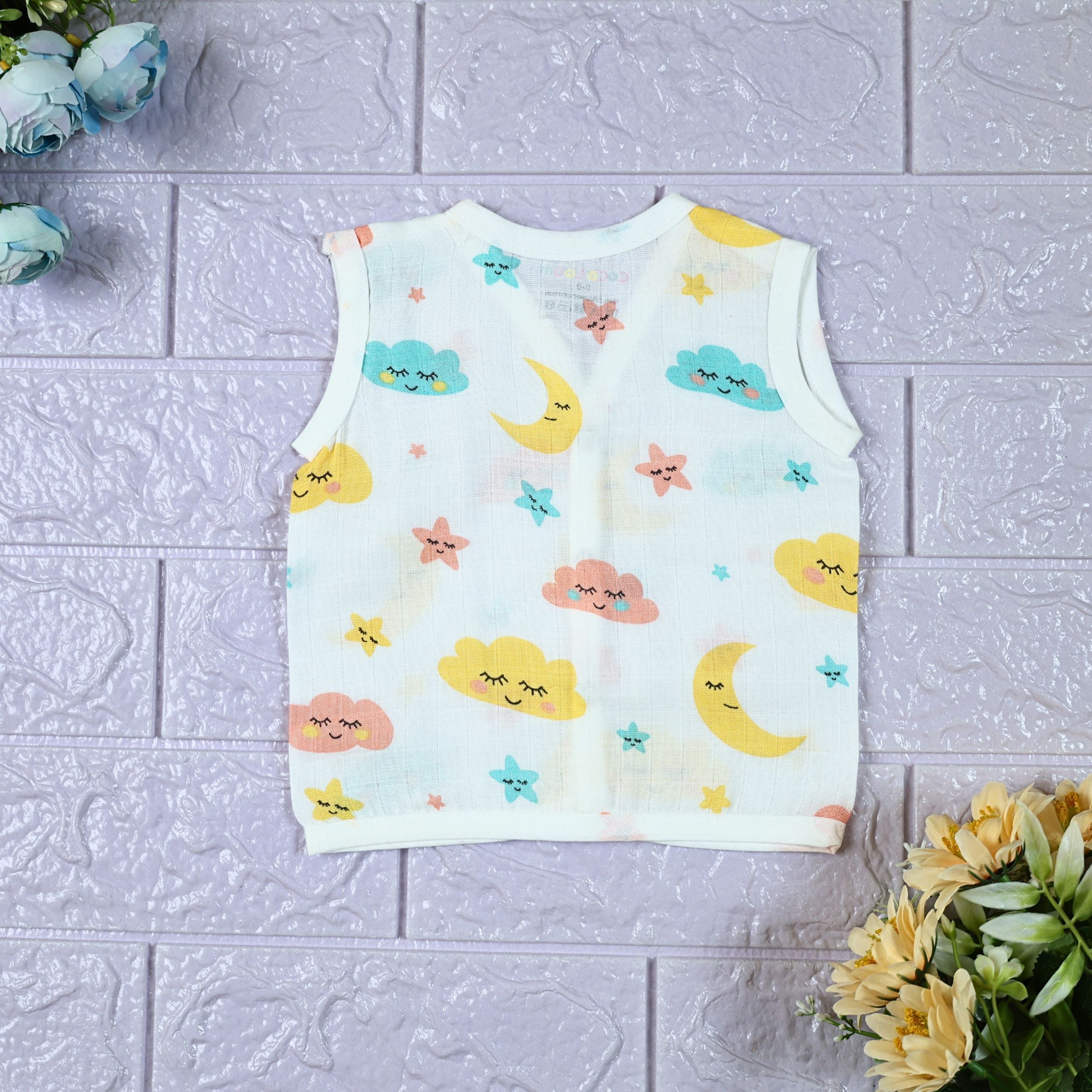 Twinkle Sky baby sleeveless top in white with snap buttons, printed with pastel cloud, stars and moon pattern