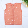 Daisy Daze baby sleeveless top in orange color with snap buttons printed with white floral patterns