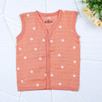 Daisy Daze baby sleeveless top in orange color with snap buttons printed with white floral patterns
