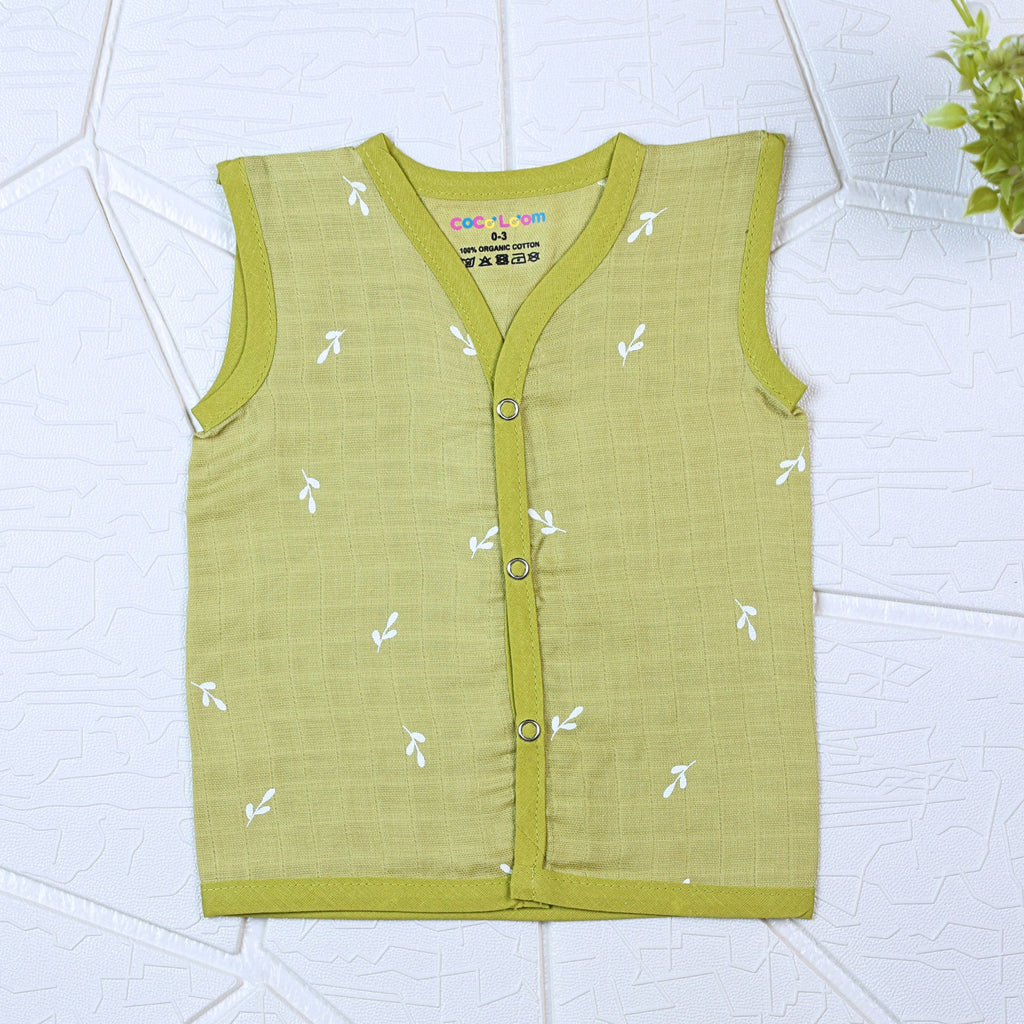 Green Twigs baby sleeveless top in green with snap buttons printed with white floral patterns