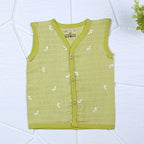 Green Twigs baby sleeveless top in green with snap buttons printed with white floral patterns
