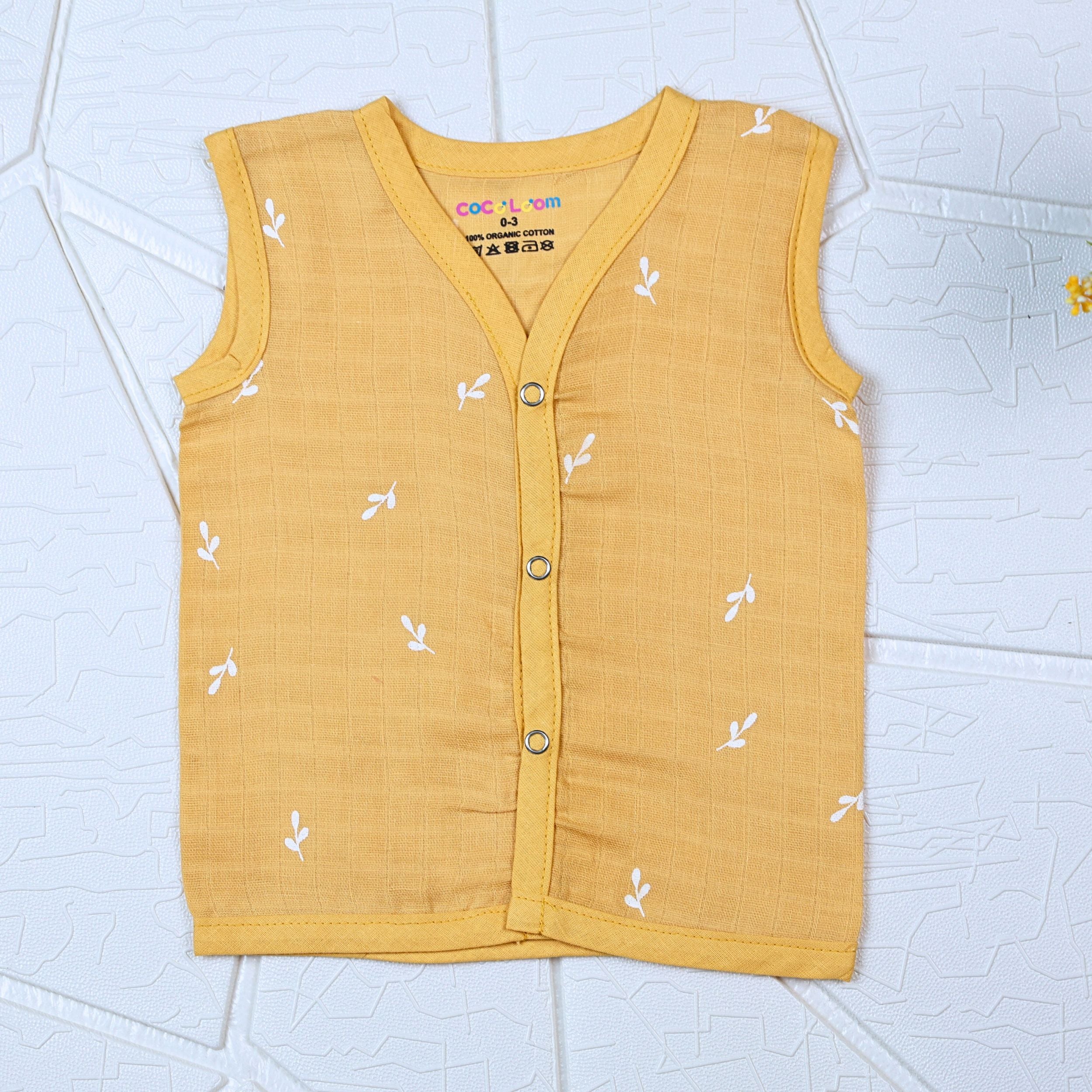 Mustard Sprigs baby sleeveless top in yellow with snap buttons printed with white floral patterns 