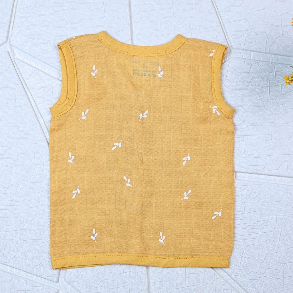 Mustard Sprigs baby sleeveless top in yellow with snap buttons printed with white floral patterns 